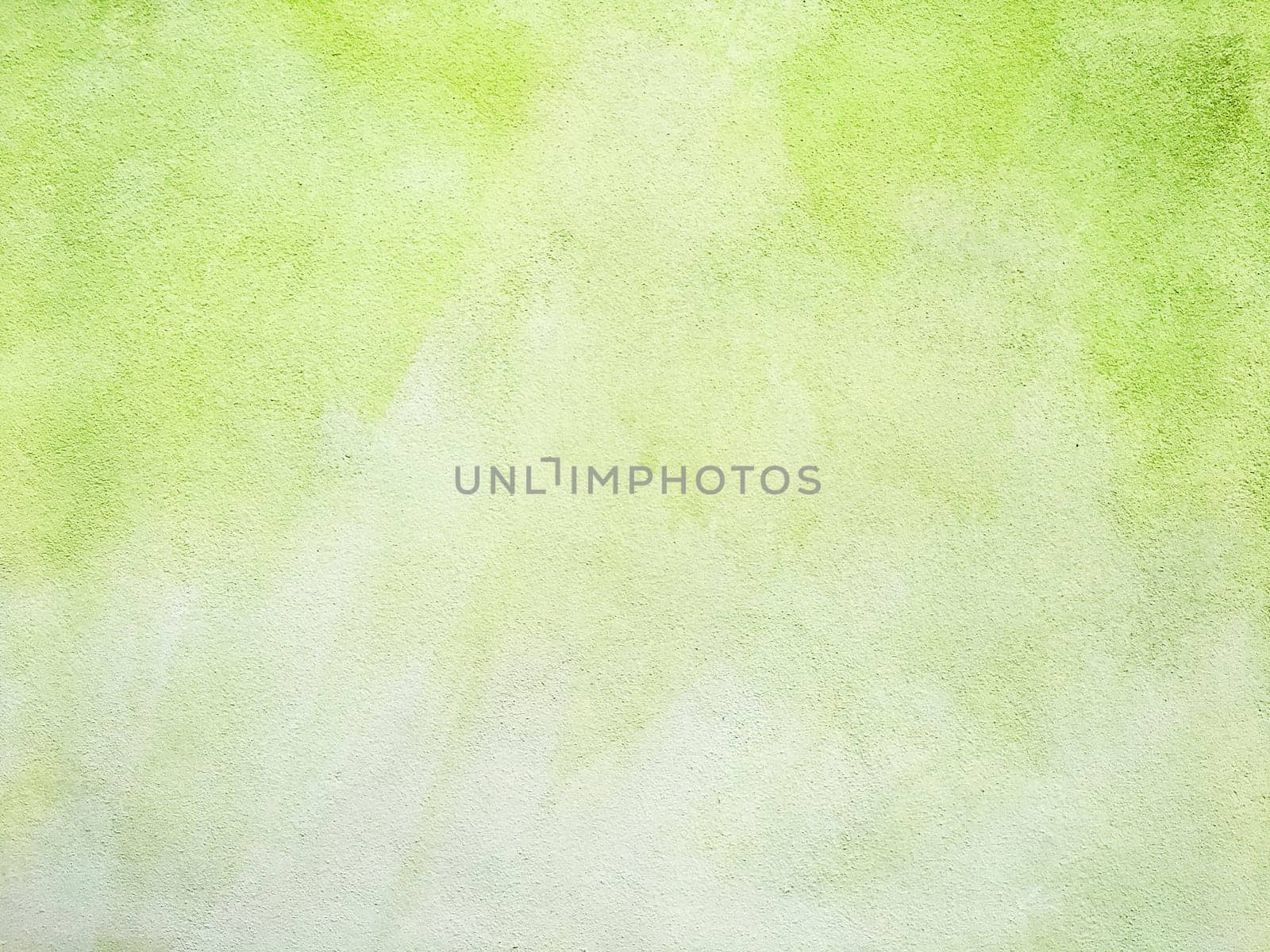 Concrete lime green colorful wall surface texture. Abstract grunge bright illuminating color background. Copyspace.