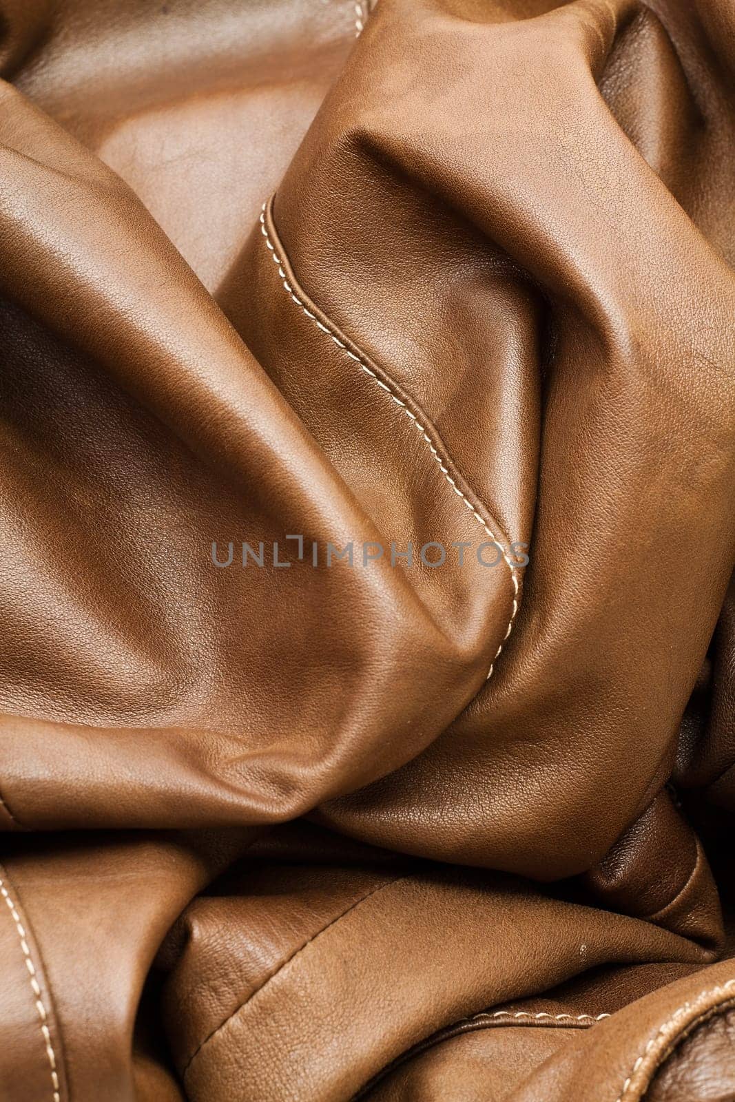 Detail of light brown leather clothing with a distinctive color and texture