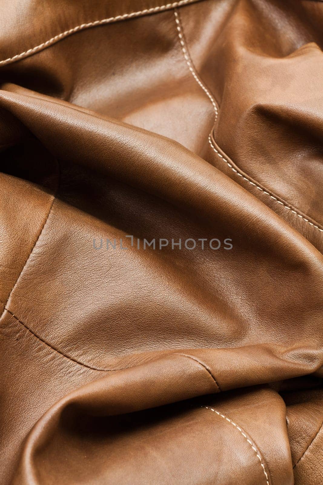 Detail of light brown leather clothing with a distinctive color and texture