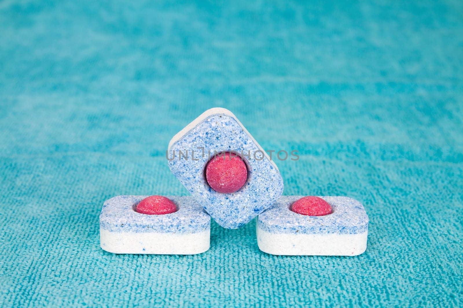 Group of three modern chemical tablets for dishwasher