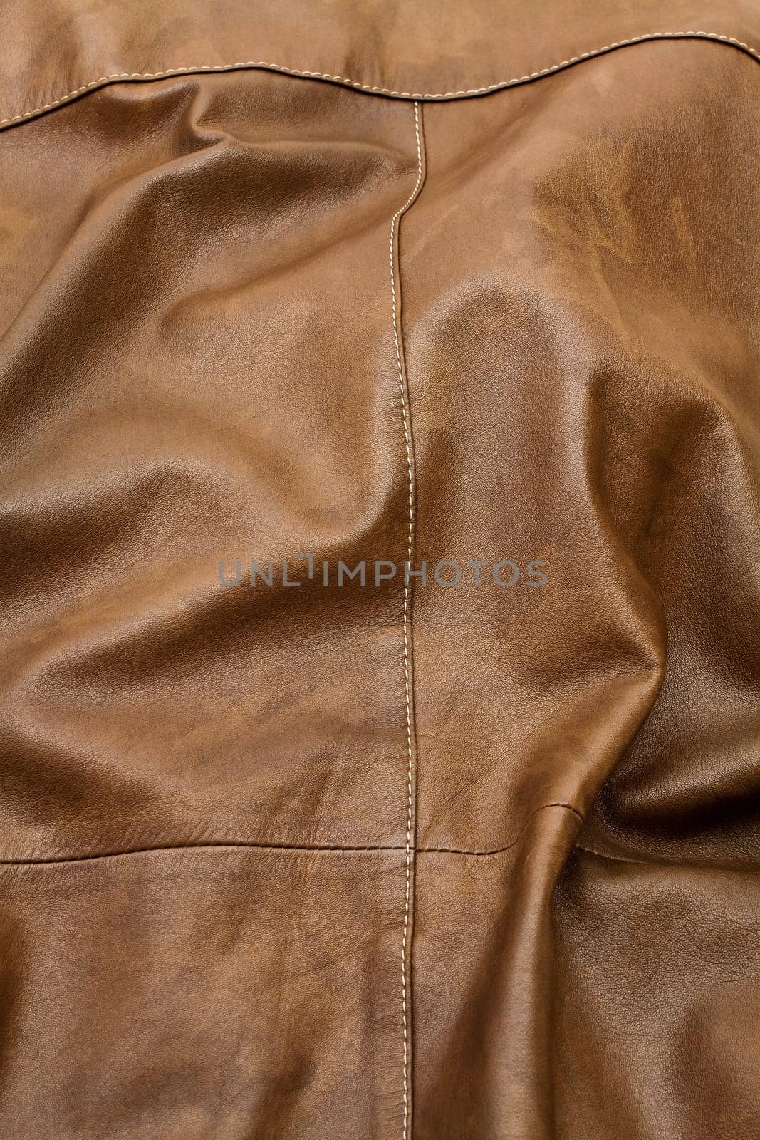 Detail of light brown leather clothing with a distinctive color and texture