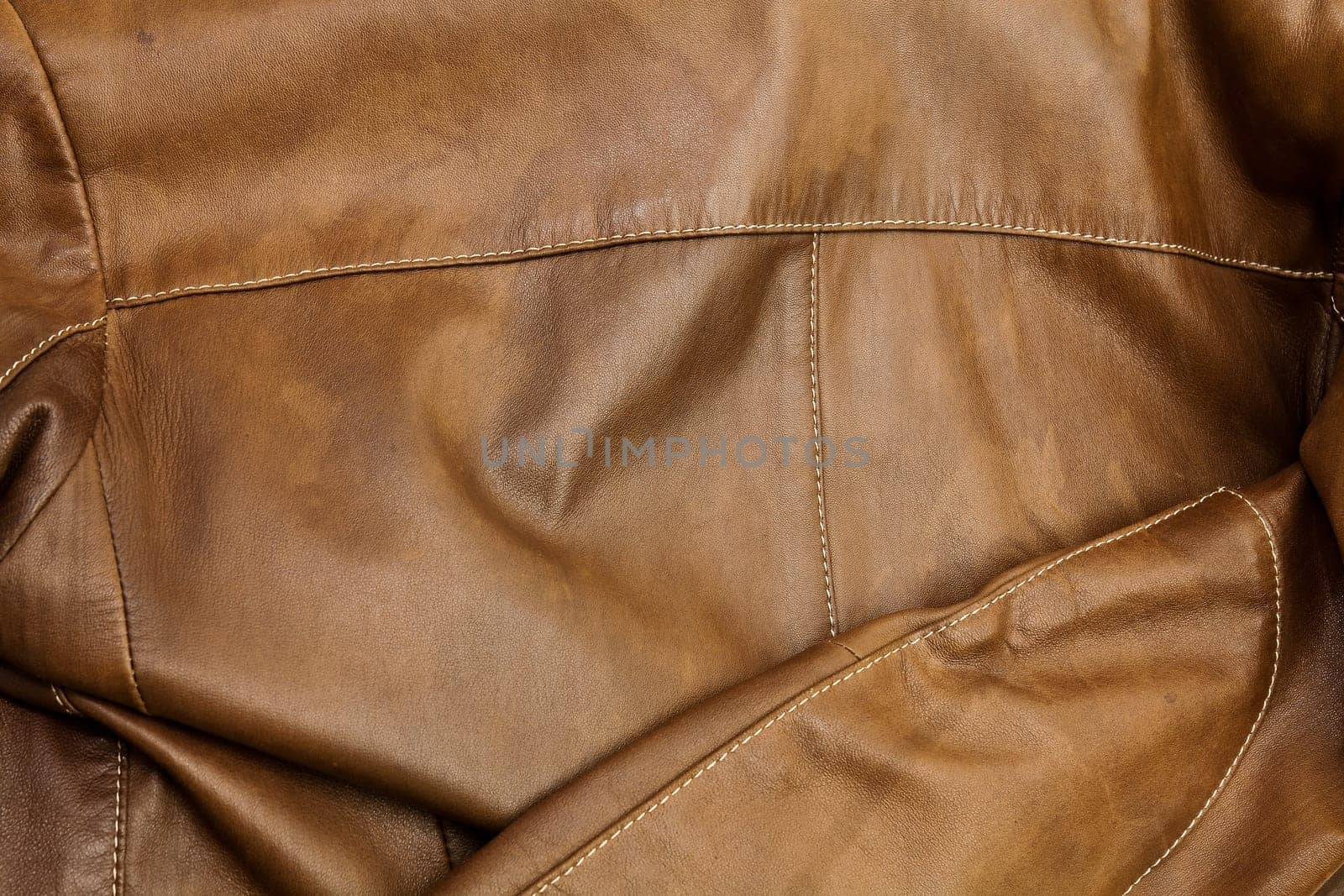 Detail of light brown leather clothing with a distinctive color and texture
