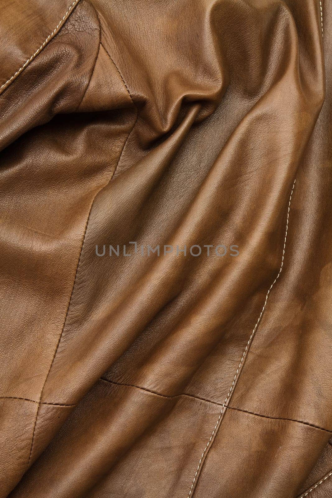 Detail of light brown leather clothing with a distinctive color and texture