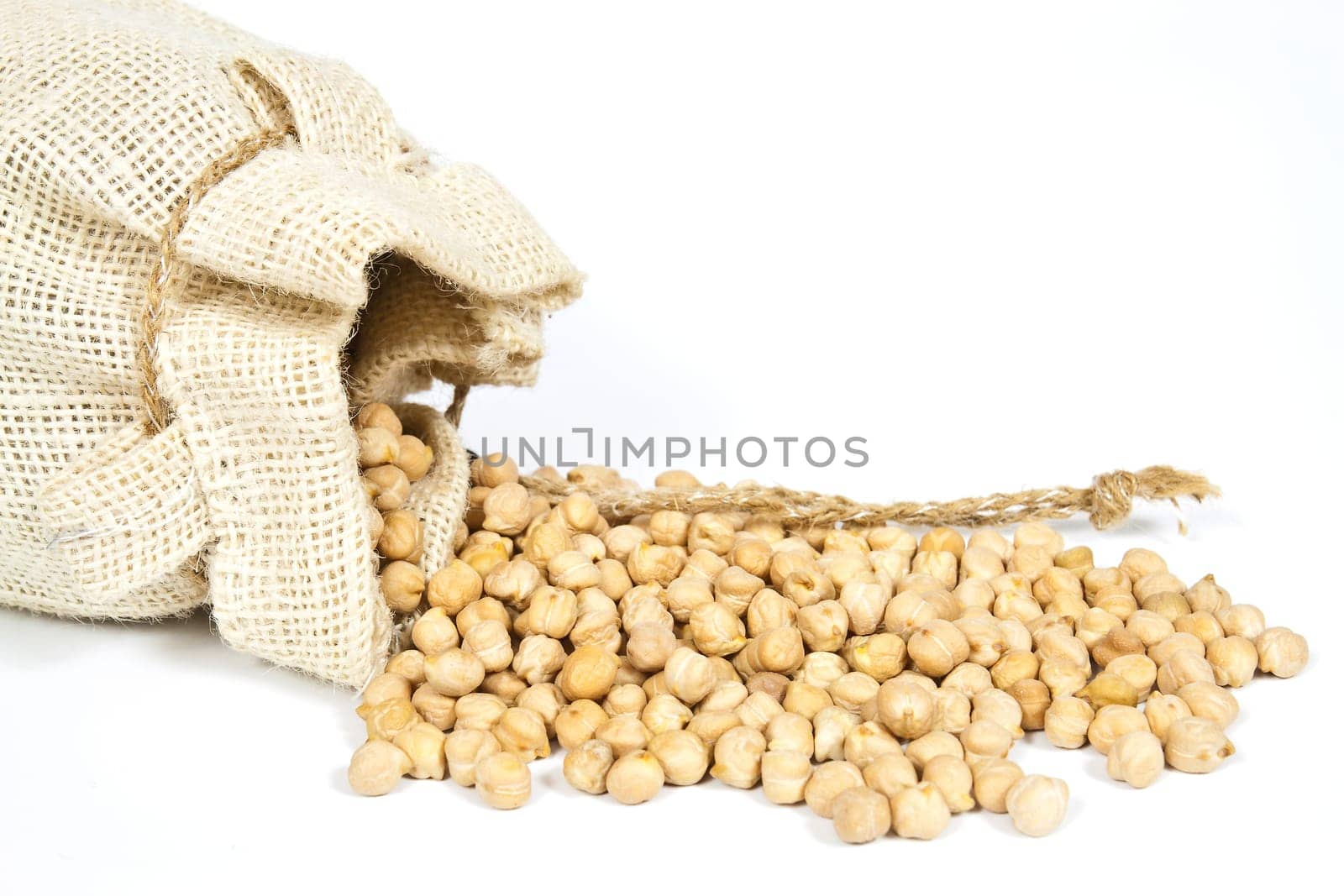 Hemp bag filled with chickpeas on a white background
