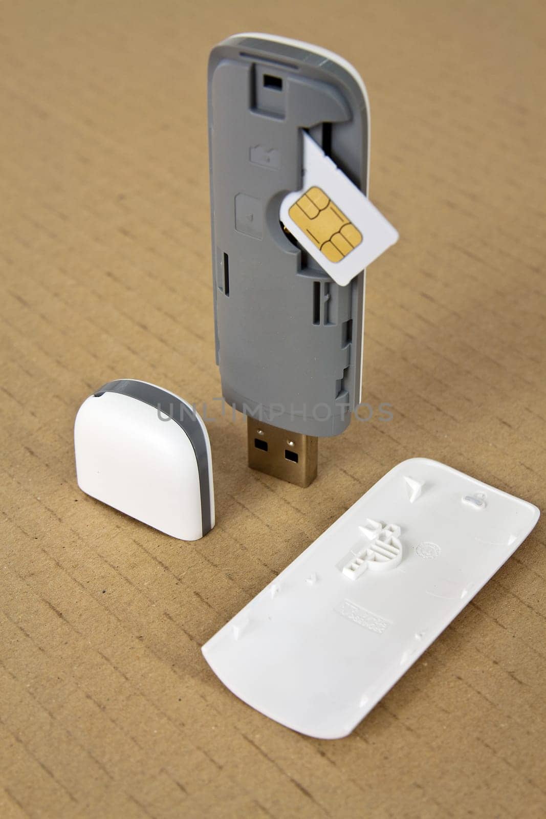 Wireless modem with a SIM card on a base of cardboard