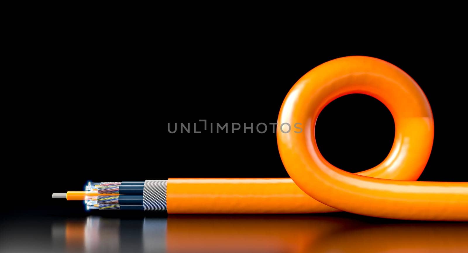 Orange fiber optic cable lying  black reflective surface with a curl