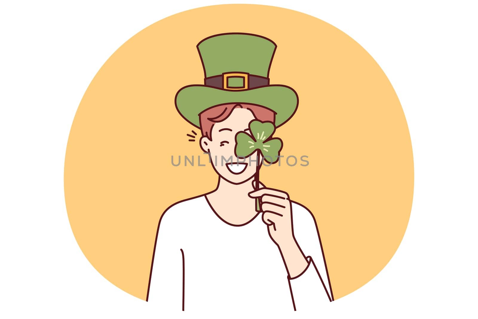 Happy man with St Patrick Day celebration accessories wearing green hat and covering eye with clover petal. Positive guy invites to traditional festival on eve of Irish holiday St Patrick Day