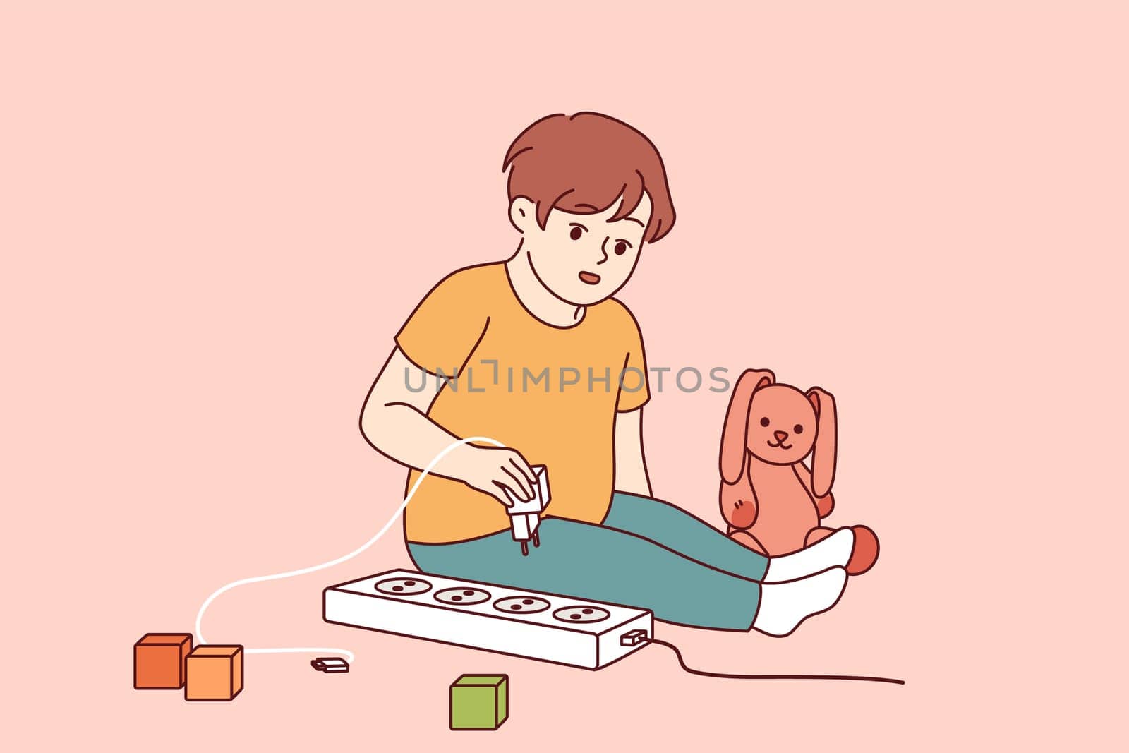 Little boy plays with electrical appliances at risk of getting electric shock due to lack of attention from parents. Child spends time alone playing with electrical outlet that can cause injury