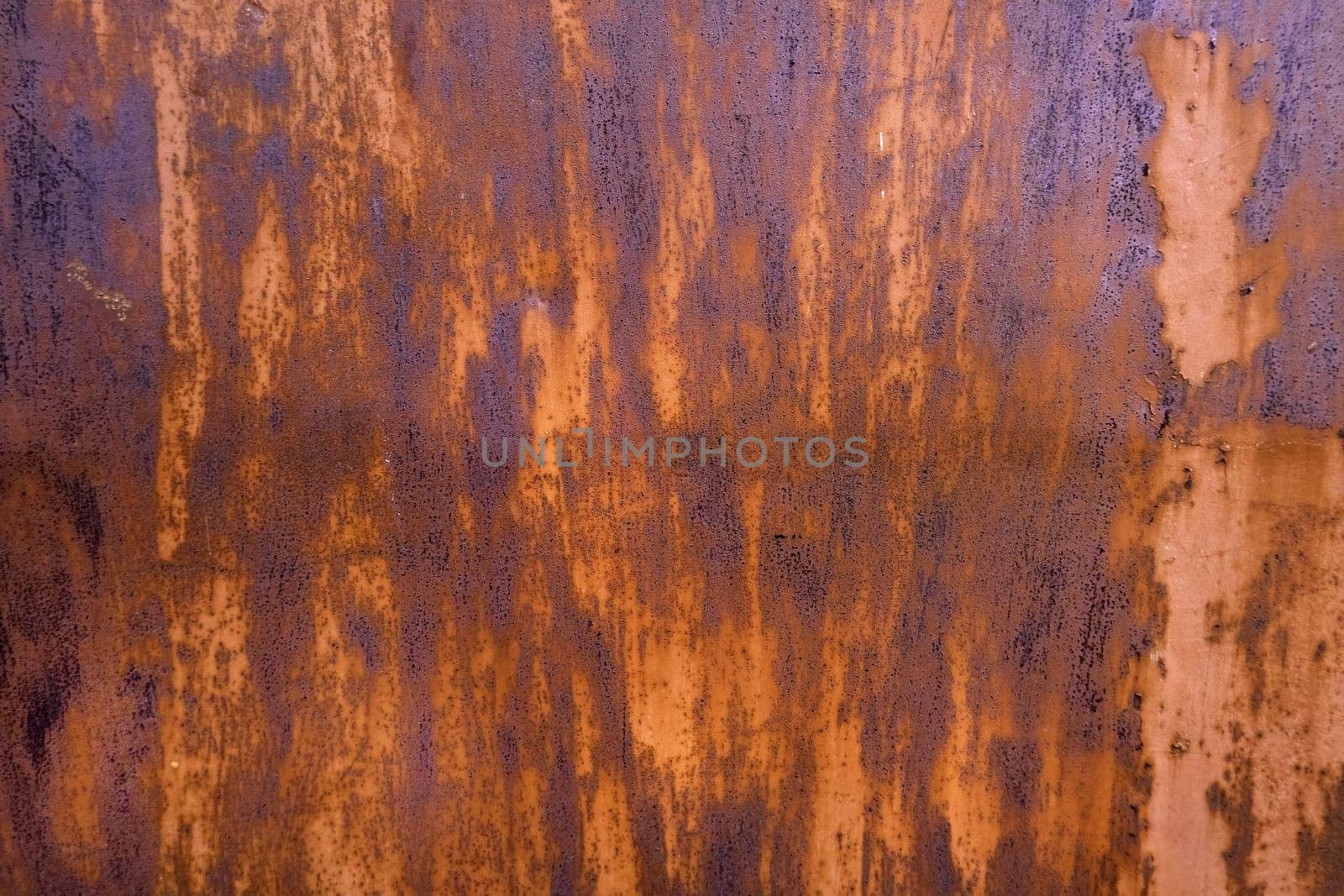 Detail of old metal wall damaged by time, ruin
