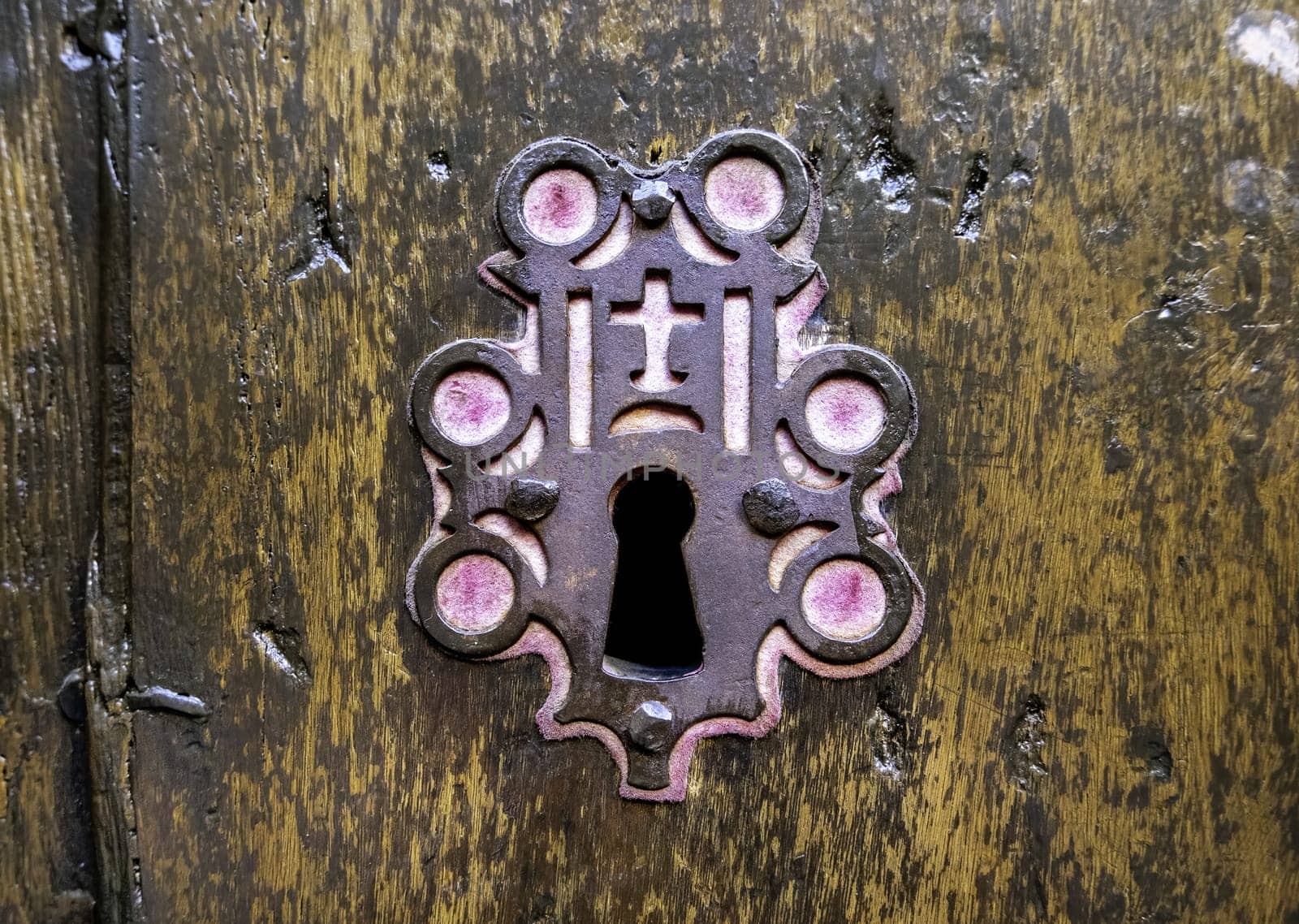 Detail of old lock decorated with religious symbols