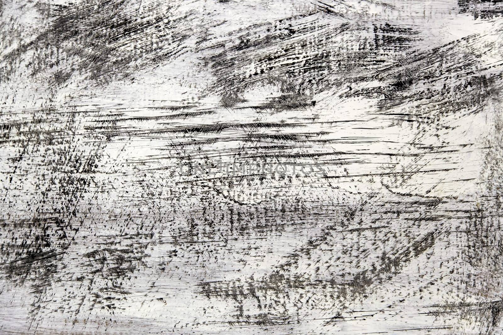 Detail of scratched and damaged white wall, ruin and crime
