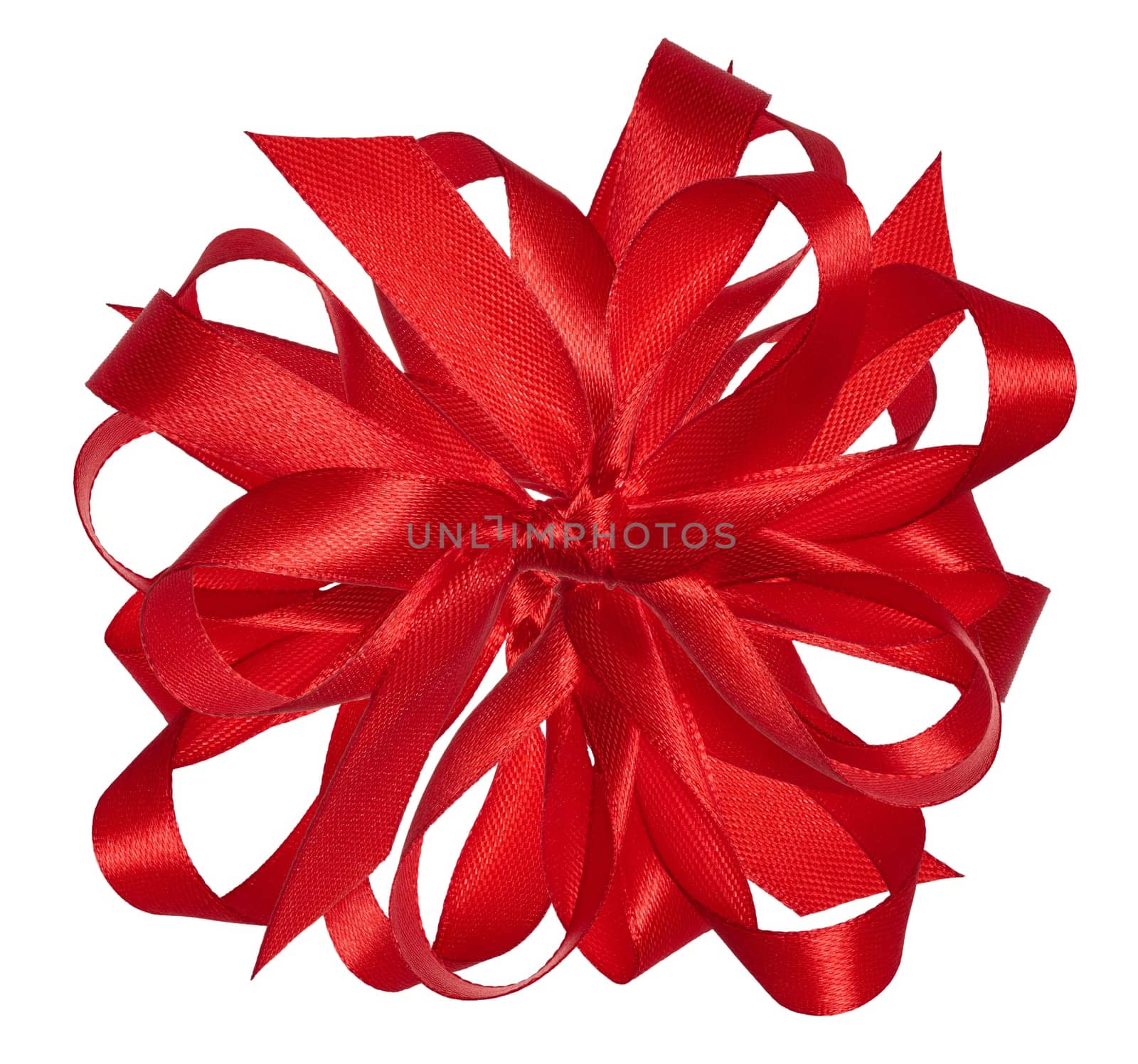Knotted yellow silk ribbon in a bow on an isolated background, top view