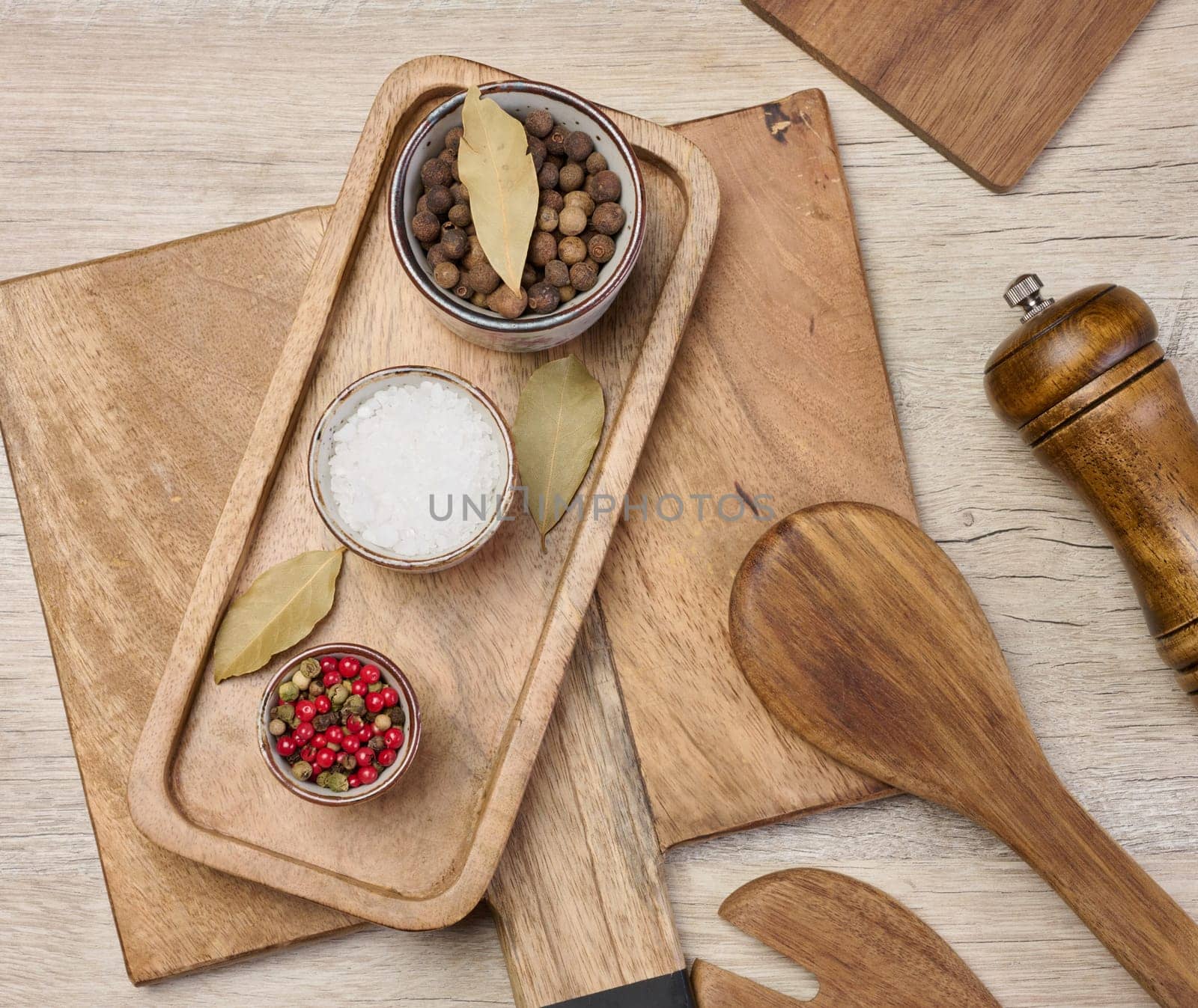 White salt, peppercorns on the table, top view. Spice