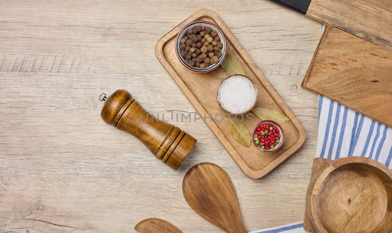 White salt, peppercorns on the table, top view. Spice