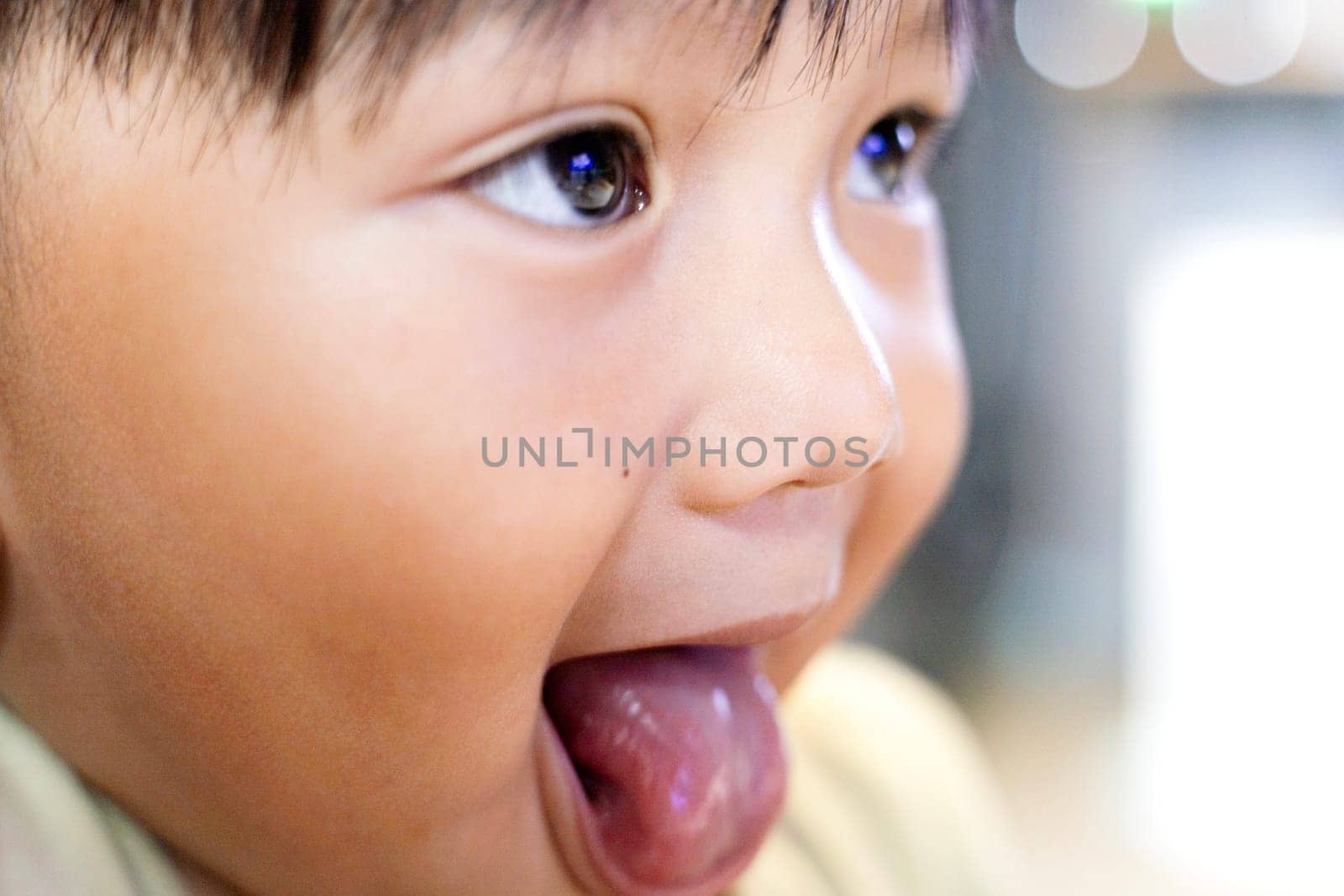 Little boy sticking his tongue out.