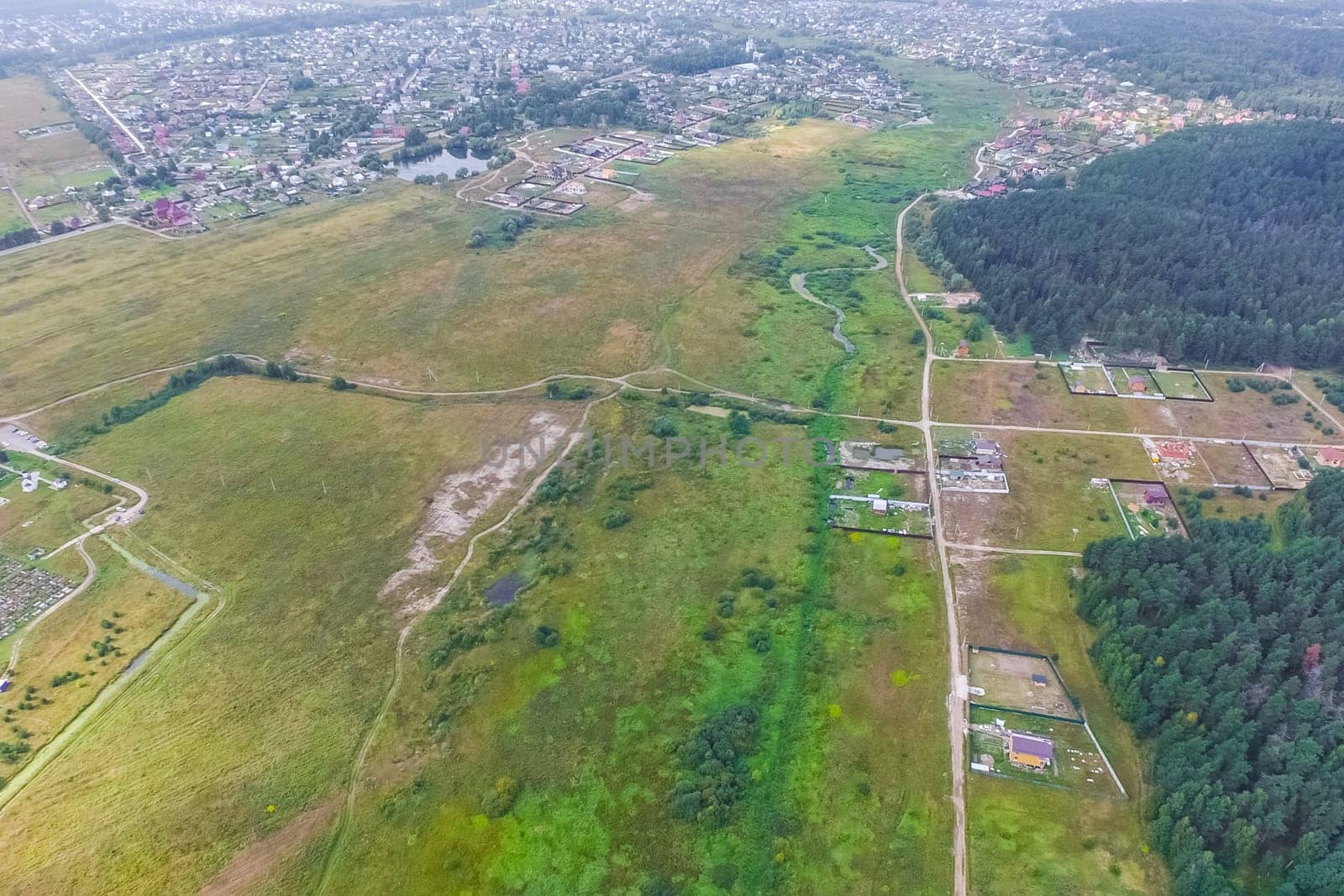 Top view of the village, fields and forests near the village