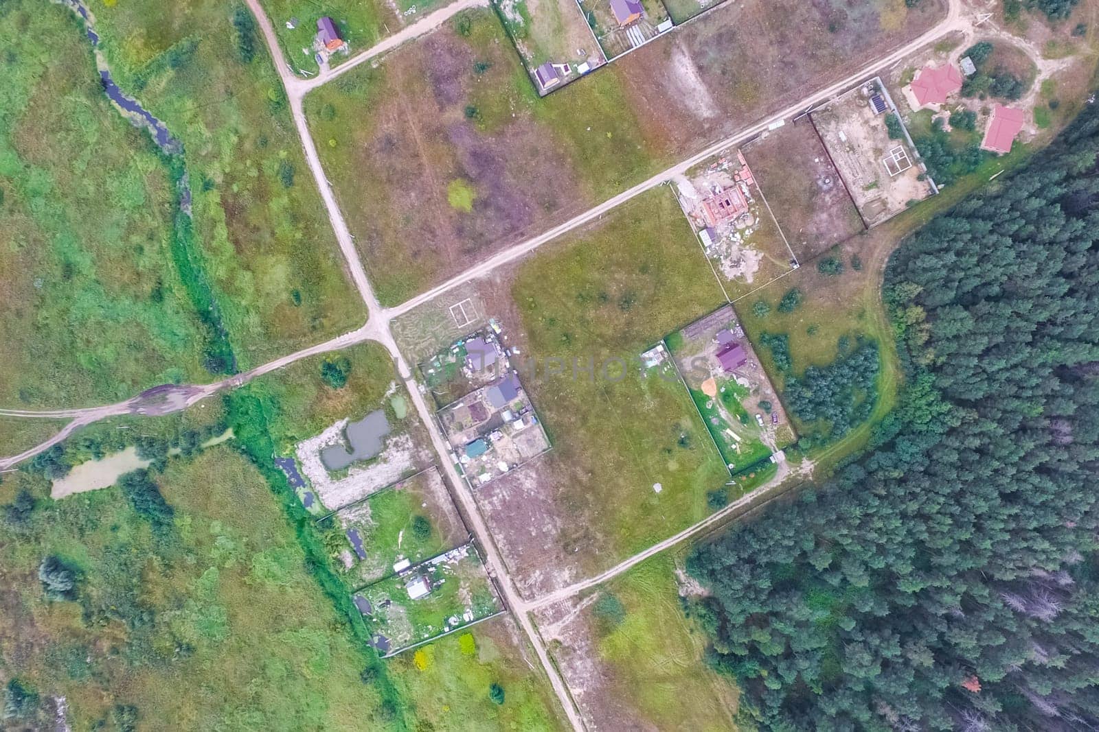 Top view of the village, fields and forests near the village
