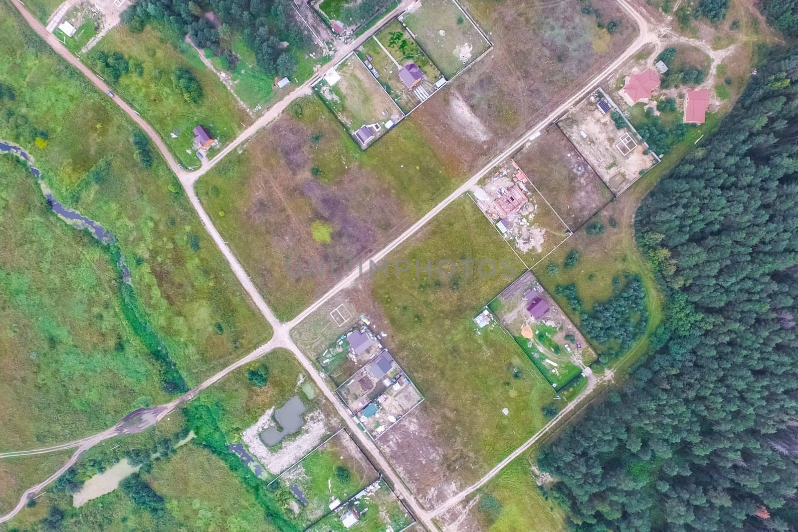 Top view of the village, fields and forests near the village