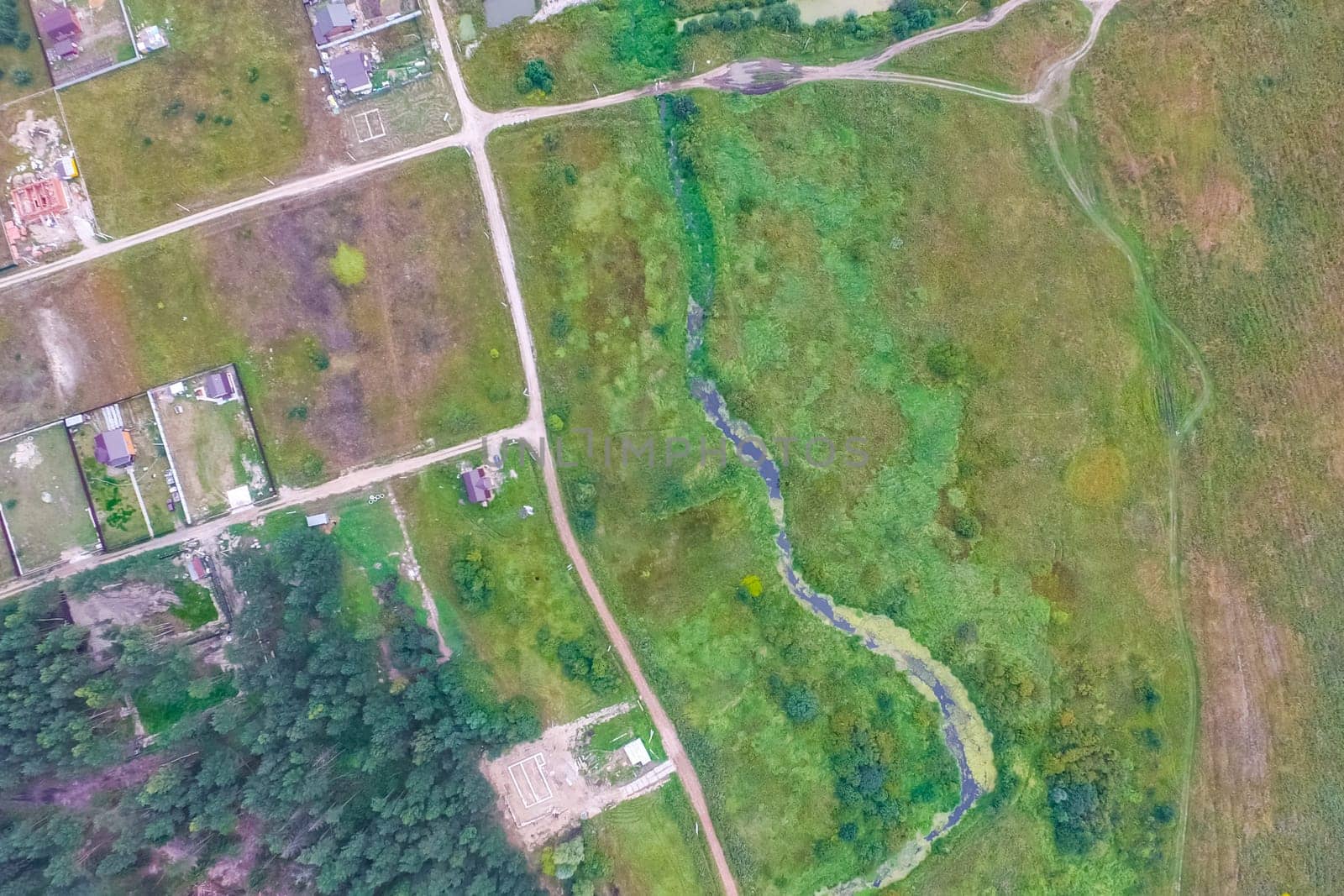 Top view of the village, fields and forests near the village