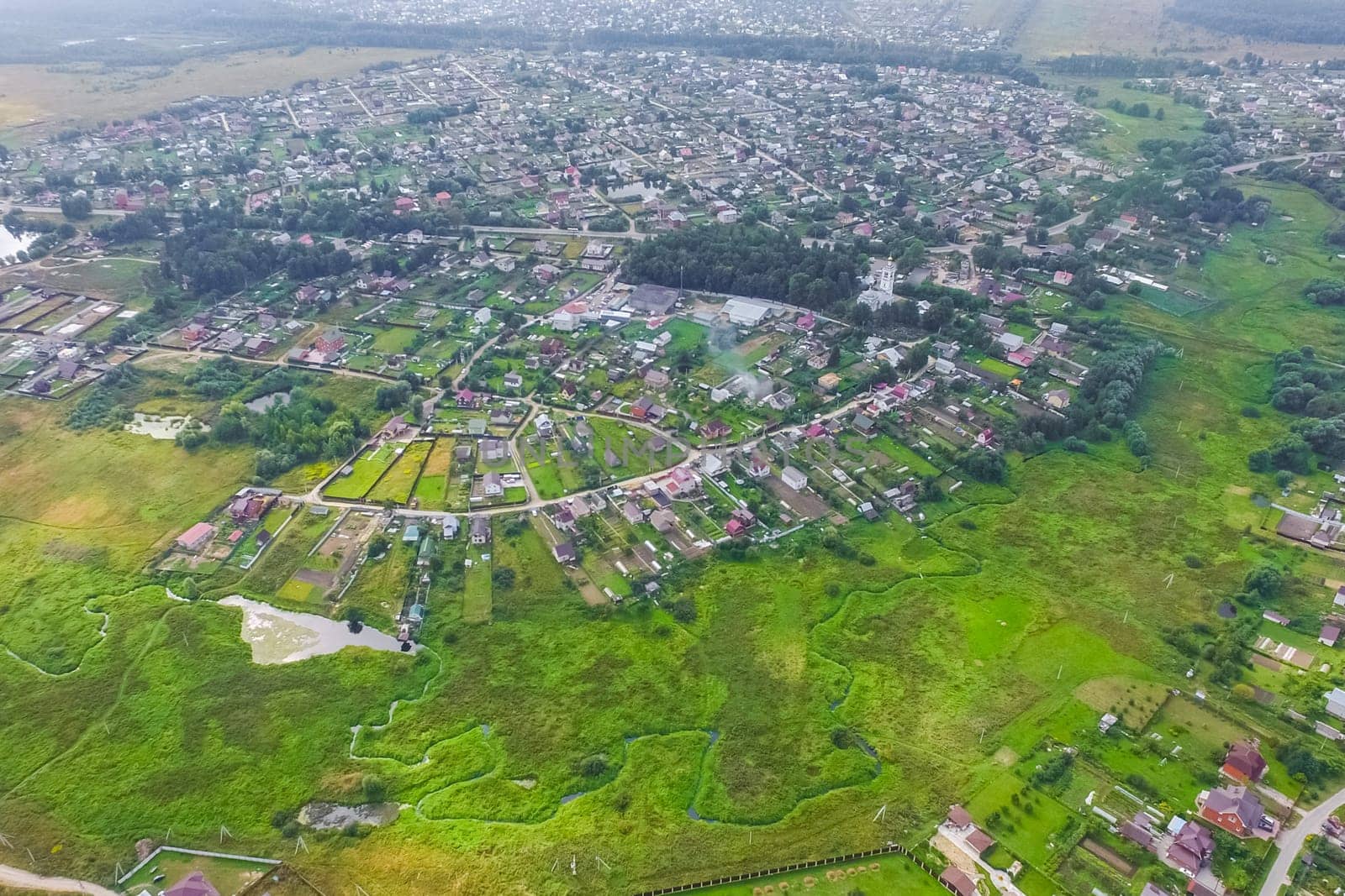 Top view of the village, fields and forests near the village