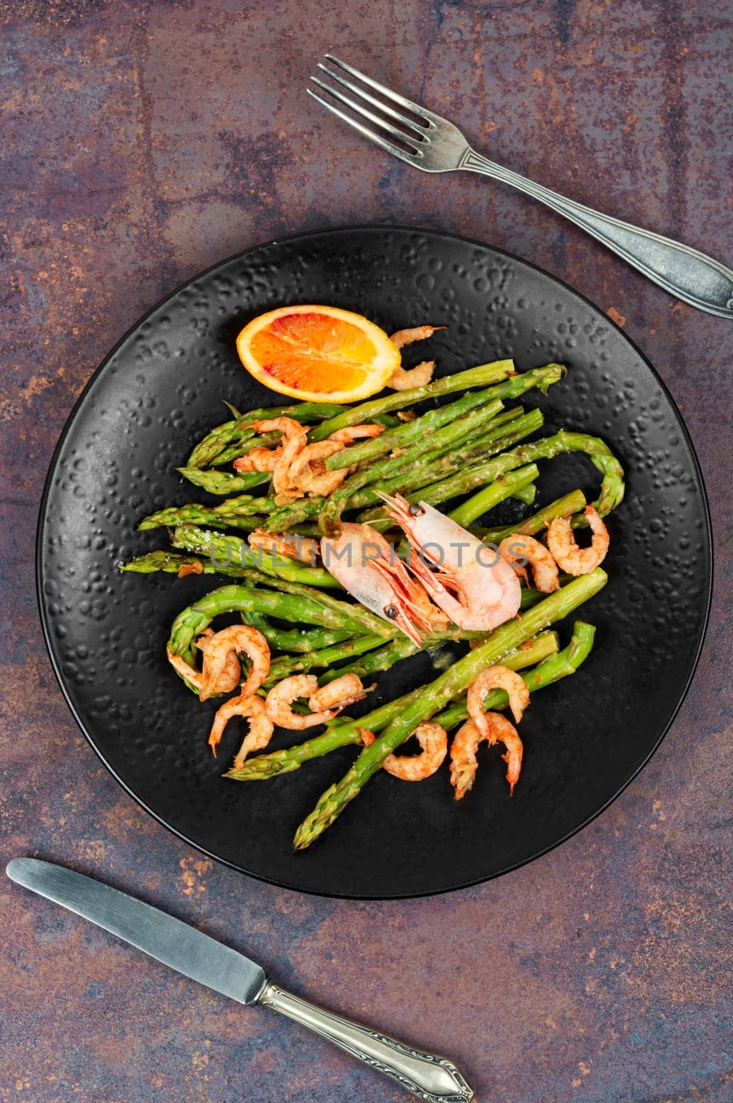 Seasonal salad with prawns, green asparagus. Boiled shrimp with green asparagus.