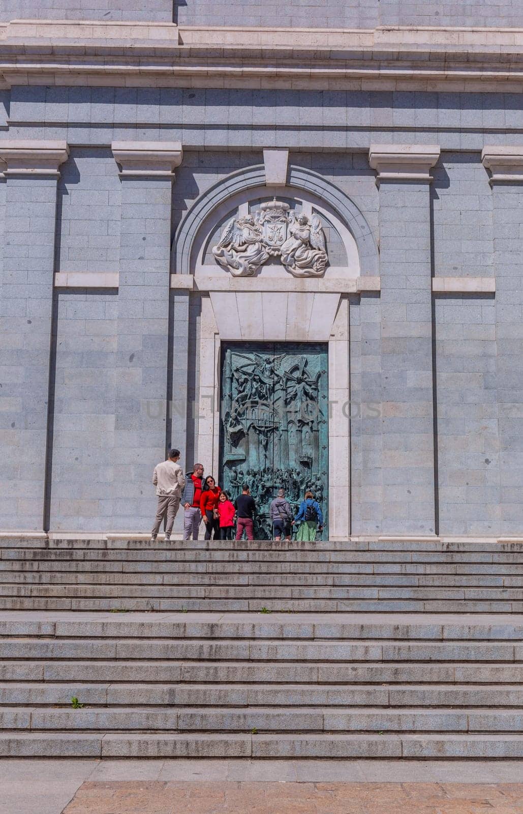 Madrid, Spain: April 24, 2024: People at the entrance of the Almudena Cathedral, Santa Maria la Real de La Almudena.