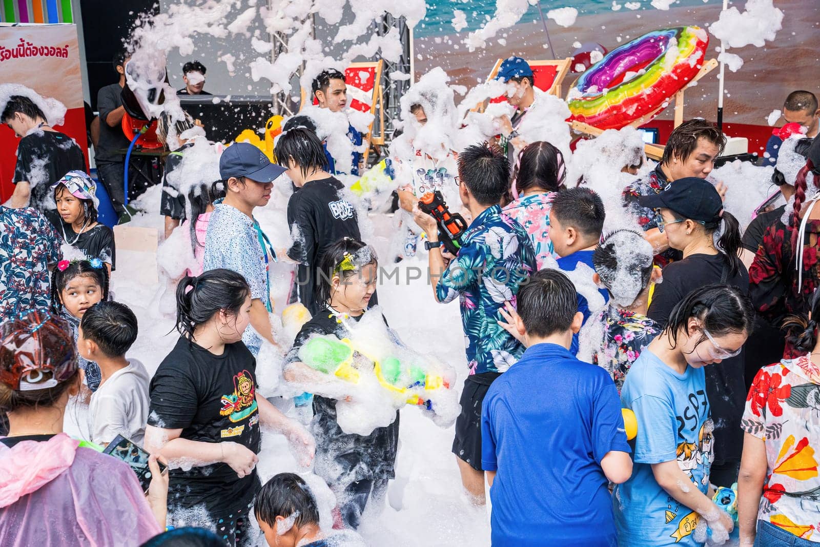 Siam Square, Bangkok, Thailand - APR 13, 2024 Songkran Festival, The short action of people joins celebrations of the Thai New Year or Songkran in Siam Square Bangkok, Thailand.