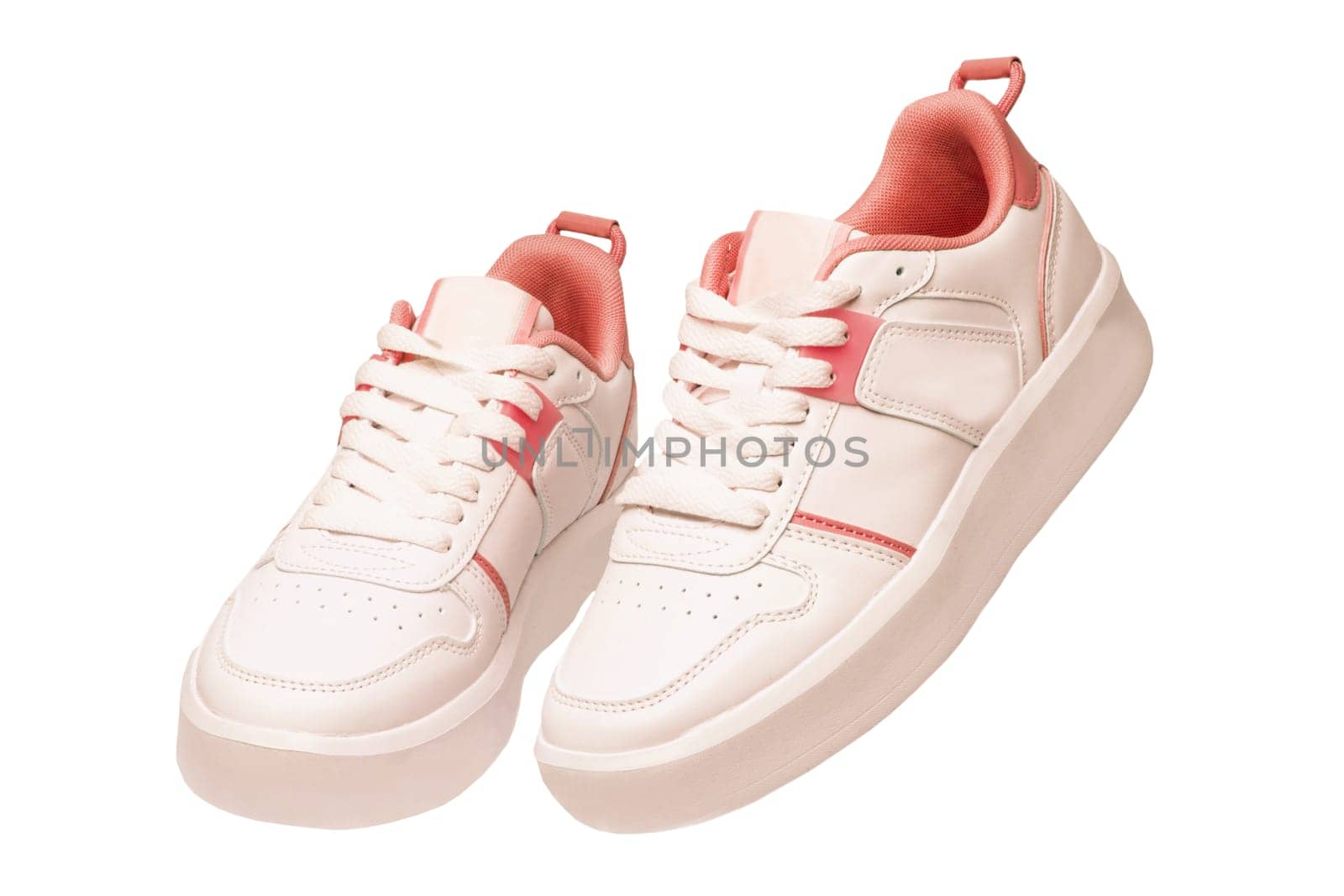 White sneaker isolated. Close-up of a pair white elegant stylish female leather high-heeled sport shoes isolated. Womens shoe fashion. Modern footwear for workout.