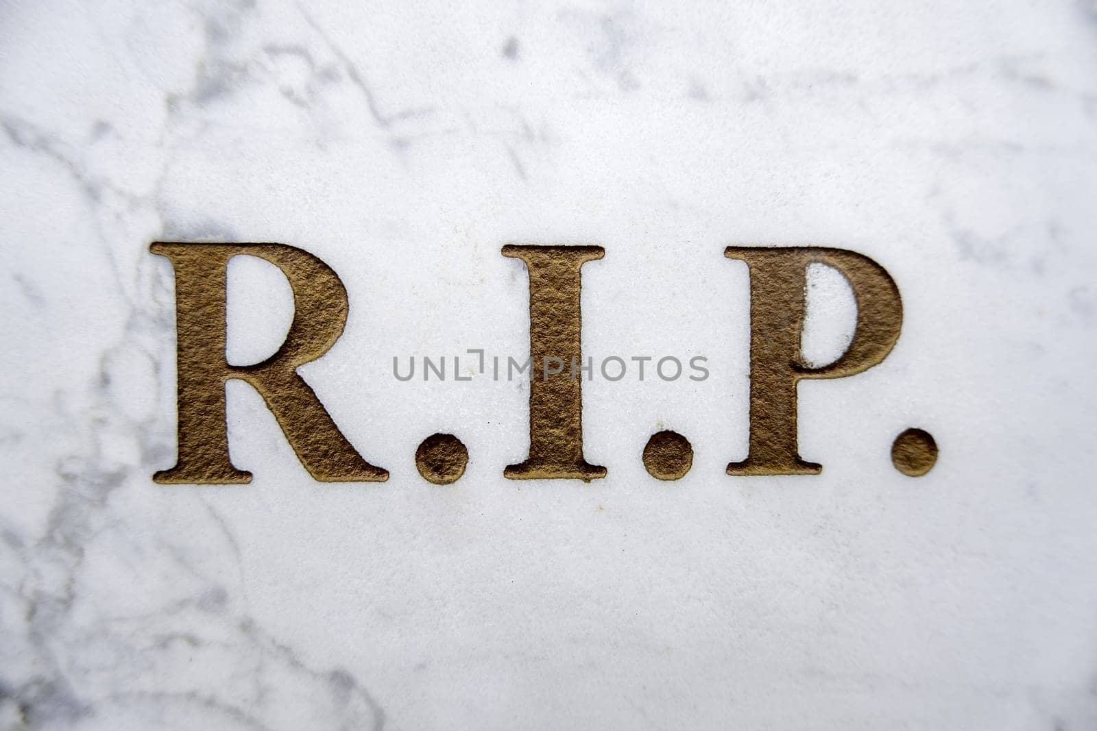 Detail of inscription on an old grave in a cemetery