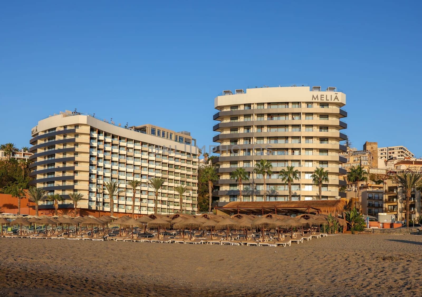 Torremolinos, Spain - September 12, 2023: View of Bajondillo Beach and hotels in Torremolinos at sunrise. Costa del Sol, Spain.