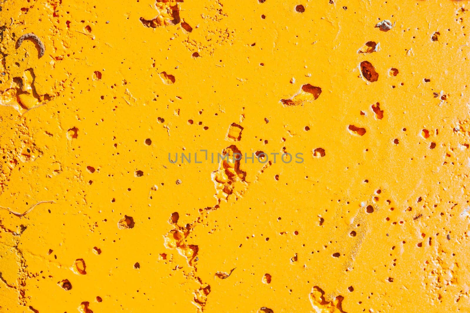 Orange painted porous metal surface, background, texture, Germany