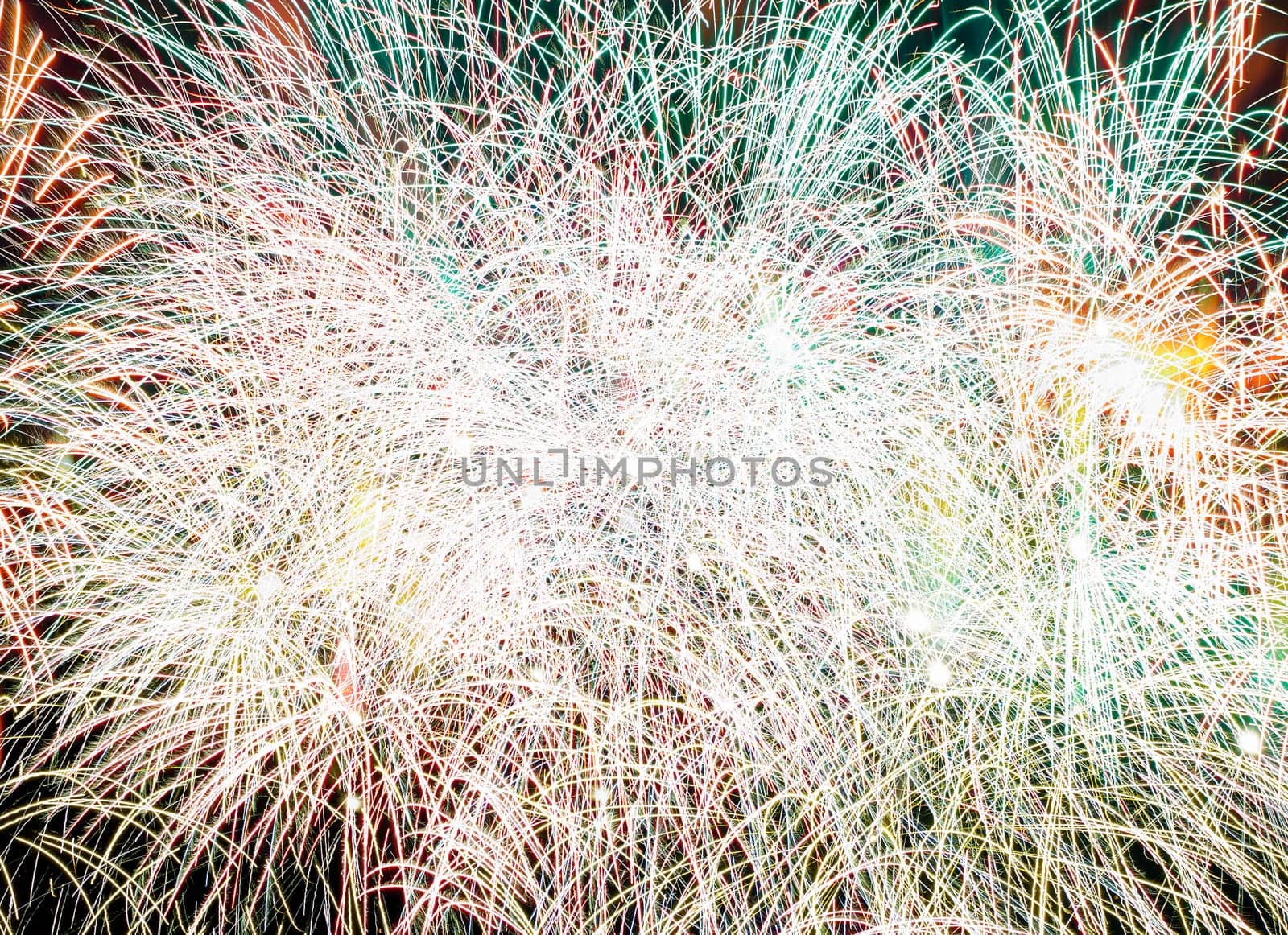 composite closeup photo of fireworks in black night sky.