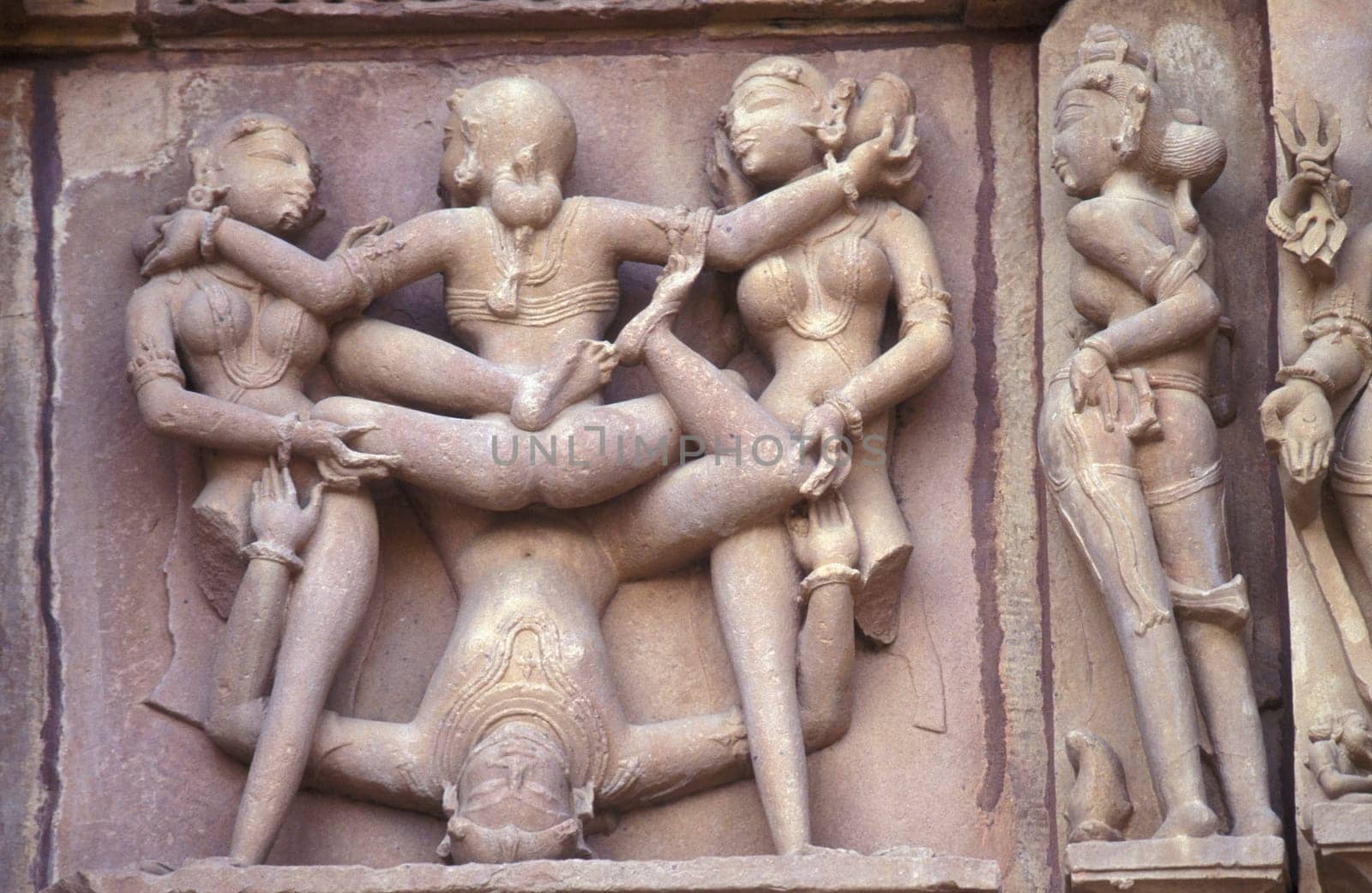 Erotic Sculptures at the erotic Temple or Hindu Temple of Kandarija Mahadeva Temple in the city of Khajurao in Province Madhya Pradesh in India.  India, Khajurao, April, 1998