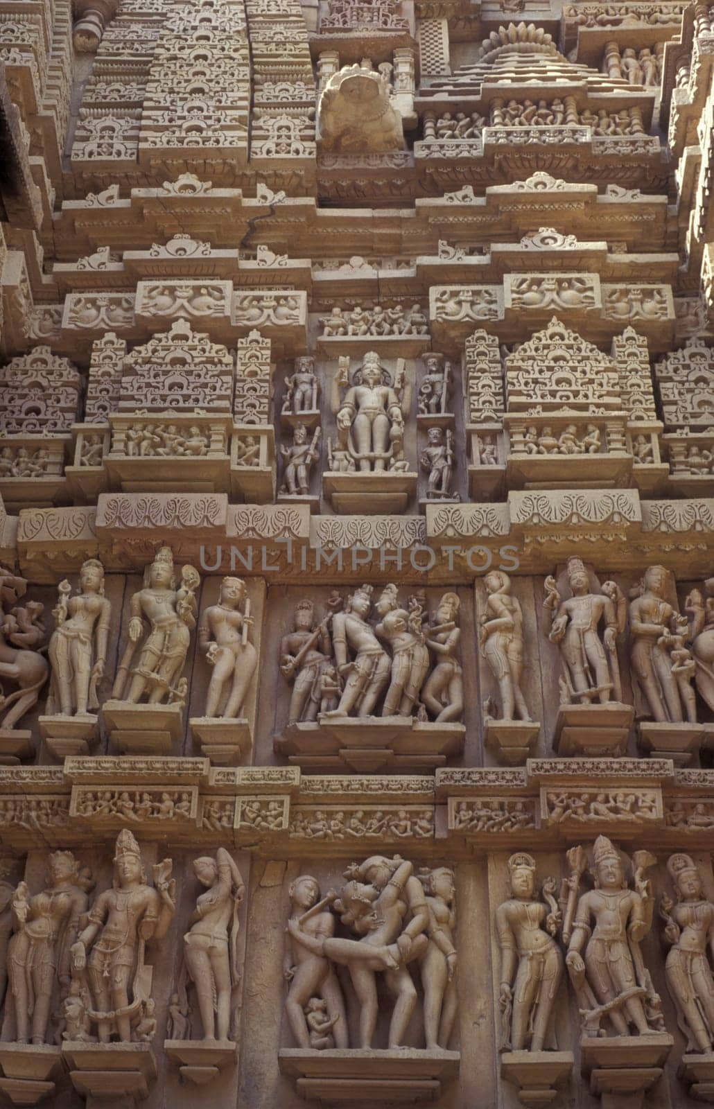 Erotic Sculptures at the erotic Temple or Hindu Temple of Kandarija Mahadeva Temple in the city of Khajurao in Province Madhya Pradesh in India.  India, Khajurao, April, 1998
