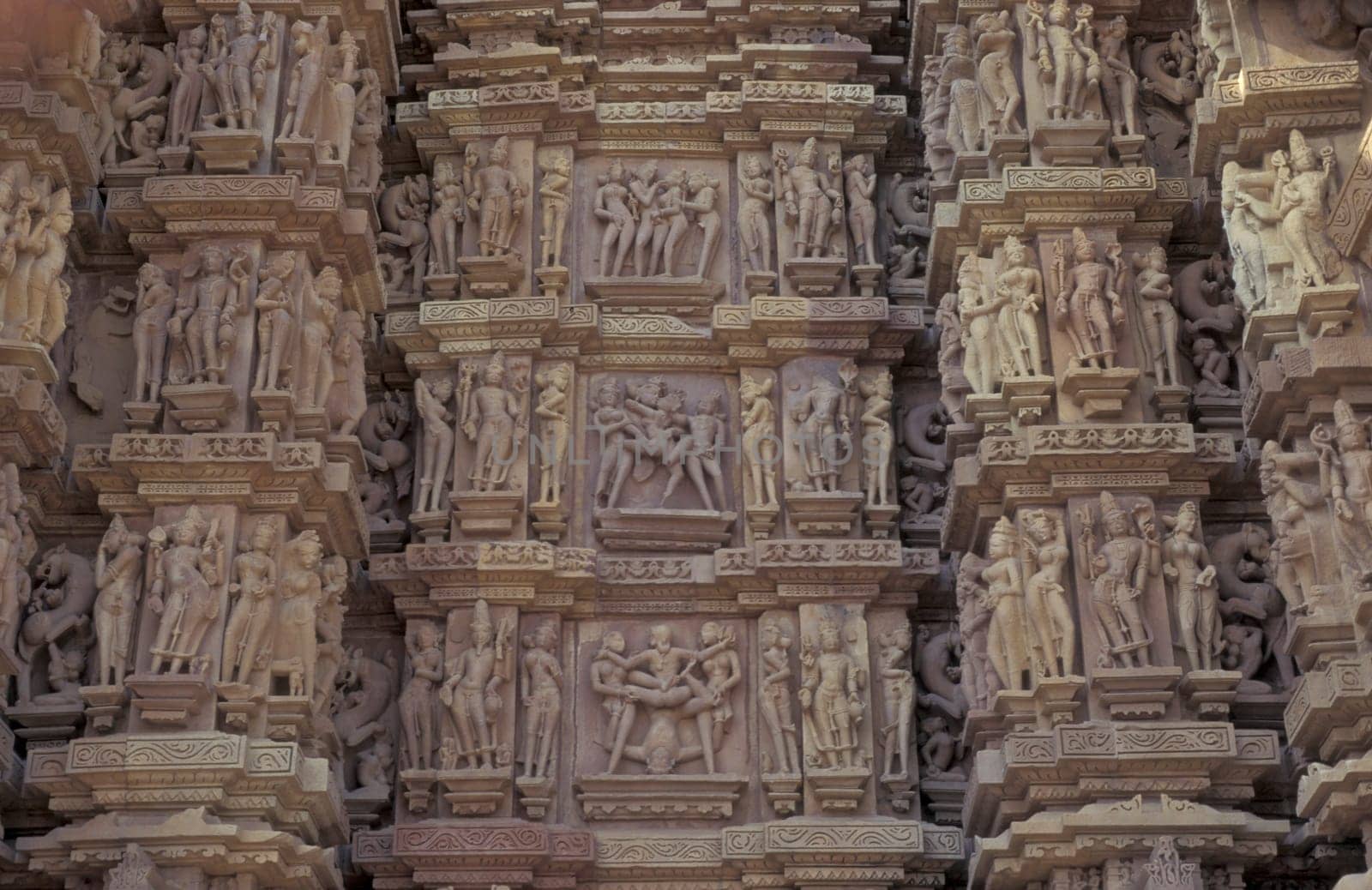 Erotic Sculptures at the erotic Temple or Hindu Temple of Kandarija Mahadeva Temple in the city of Khajurao in Province Madhya Pradesh in India.  India, Khajurao, April, 1998