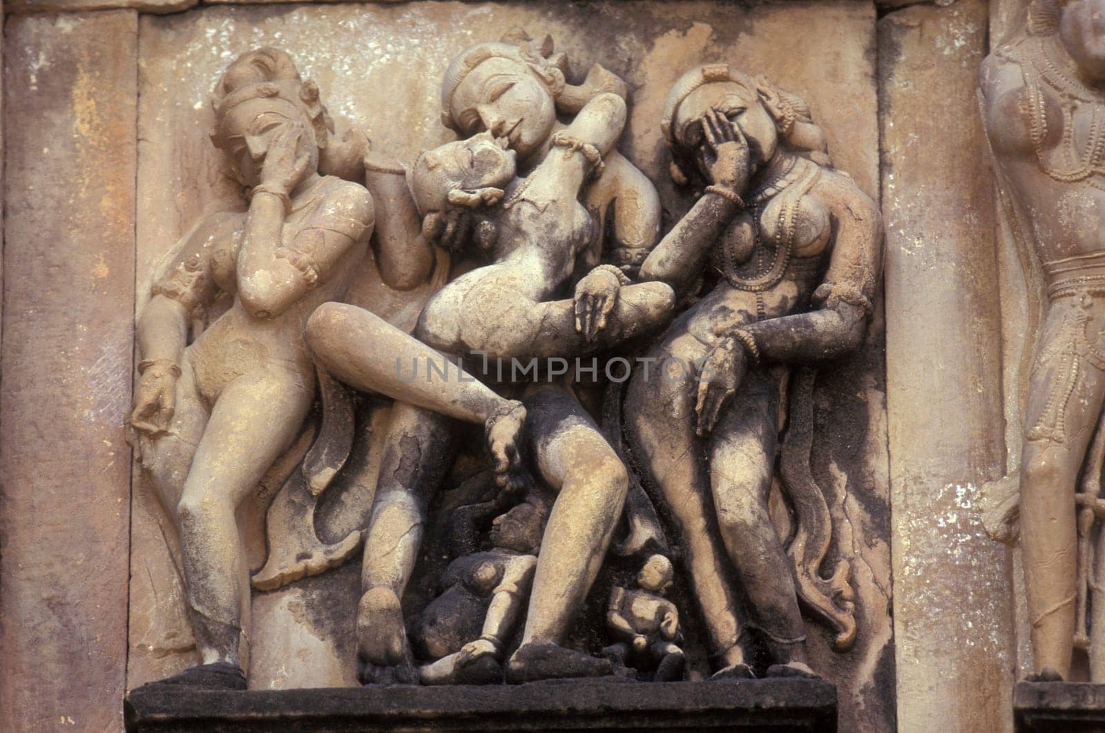 Erotic Sculptures at the erotic Temple or Hindu Temple of Kandarija Mahadeva Temple in the city of Khajurao in Province Madhya Pradesh in India.  India, Khajurao, April, 1998