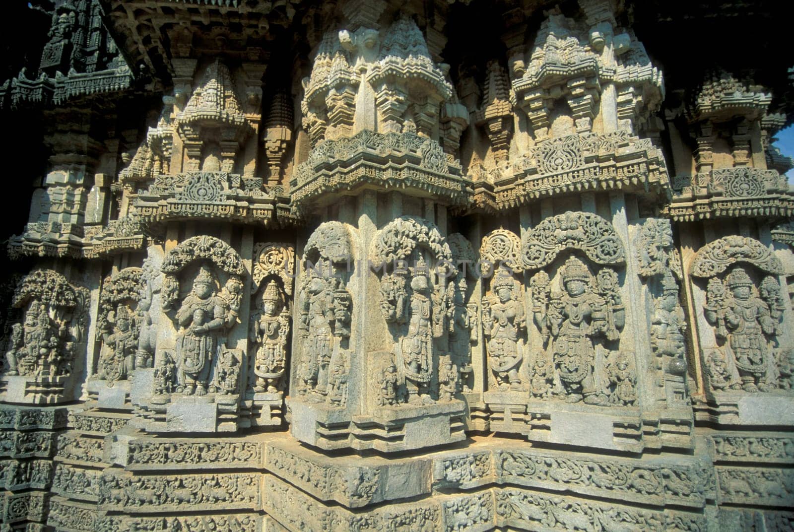 Erotic Sculptures at the erotic Temple or Hindu Temple of Kandarija Mahadeva Temple in the city of Khajurao in Province Madhya Pradesh in India.  India, Khajurao, April, 1998