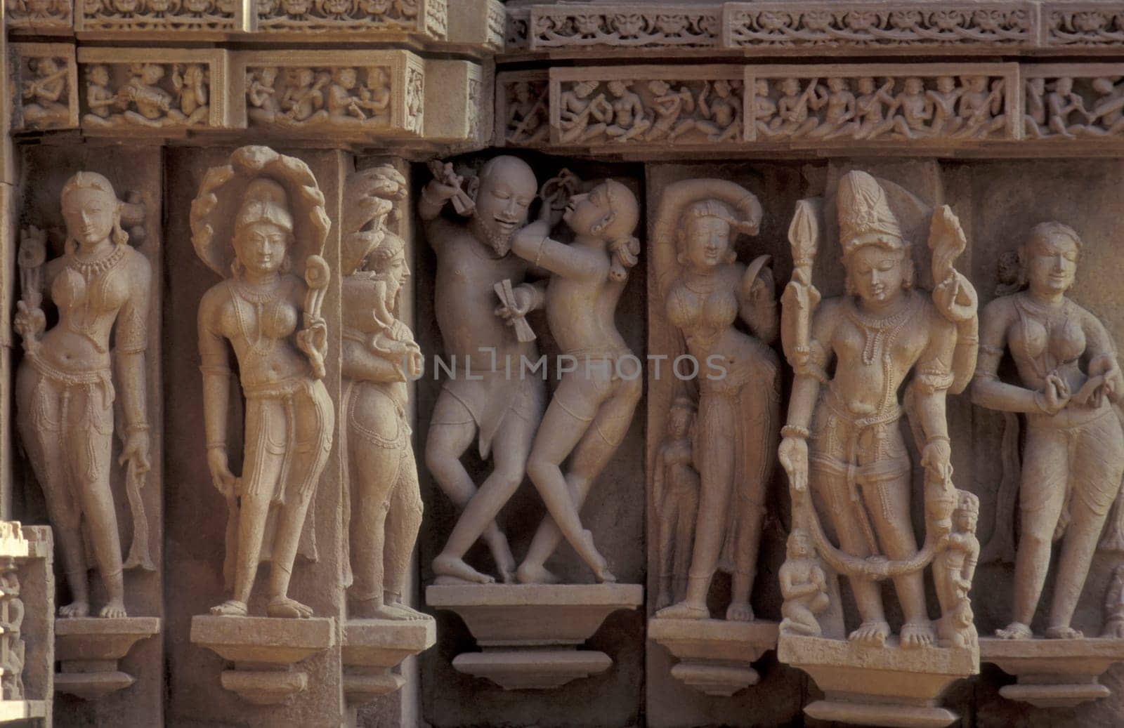 Erotic Sculptures at the erotic Temple or Hindu Temple of Kandarija Mahadeva Temple in the city of Khajurao in Province Madhya Pradesh in India.  India, Khajurao, April, 1998