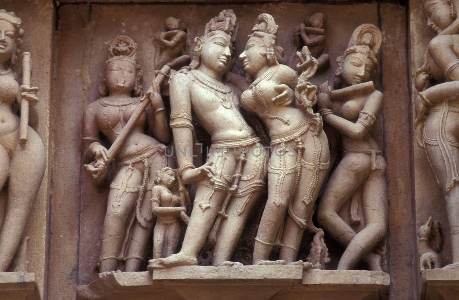Erotic Sculptures at the erotic Temple or Hindu Temple of Kandarija Mahadeva Temple in the city of Khajurao in Province Madhya Pradesh in India.  India, Khajurao, April, 1998