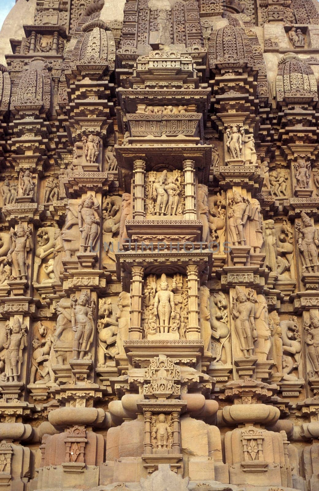 Erotic Sculptures at the erotic Temple or Hindu Temple of Kandarija Mahadeva Temple in the city of Khajurao in Province Madhya Pradesh in India.  India, Khajurao, April, 1998