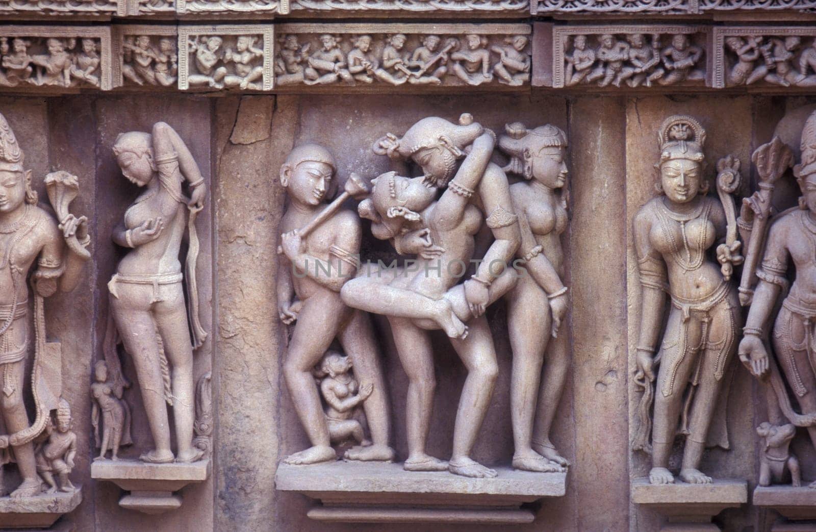 Erotic Sculptures at the erotic Temple or Hindu Temple of Kandarija Mahadeva Temple in the city of Khajurao in Province Madhya Pradesh in India.  India, Khajurao, April, 1998