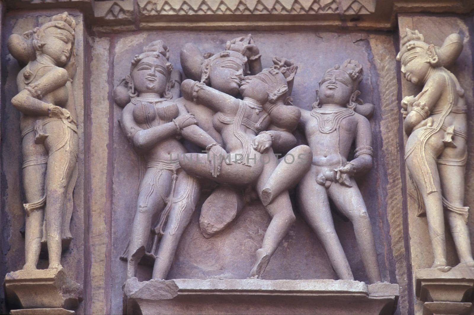 Erotic Sculptures at the erotic Temple or Hindu Temple of Kandarija Mahadeva Temple in the city of Khajurao in Province Madhya Pradesh in India.  India, Khajurao, April, 1998