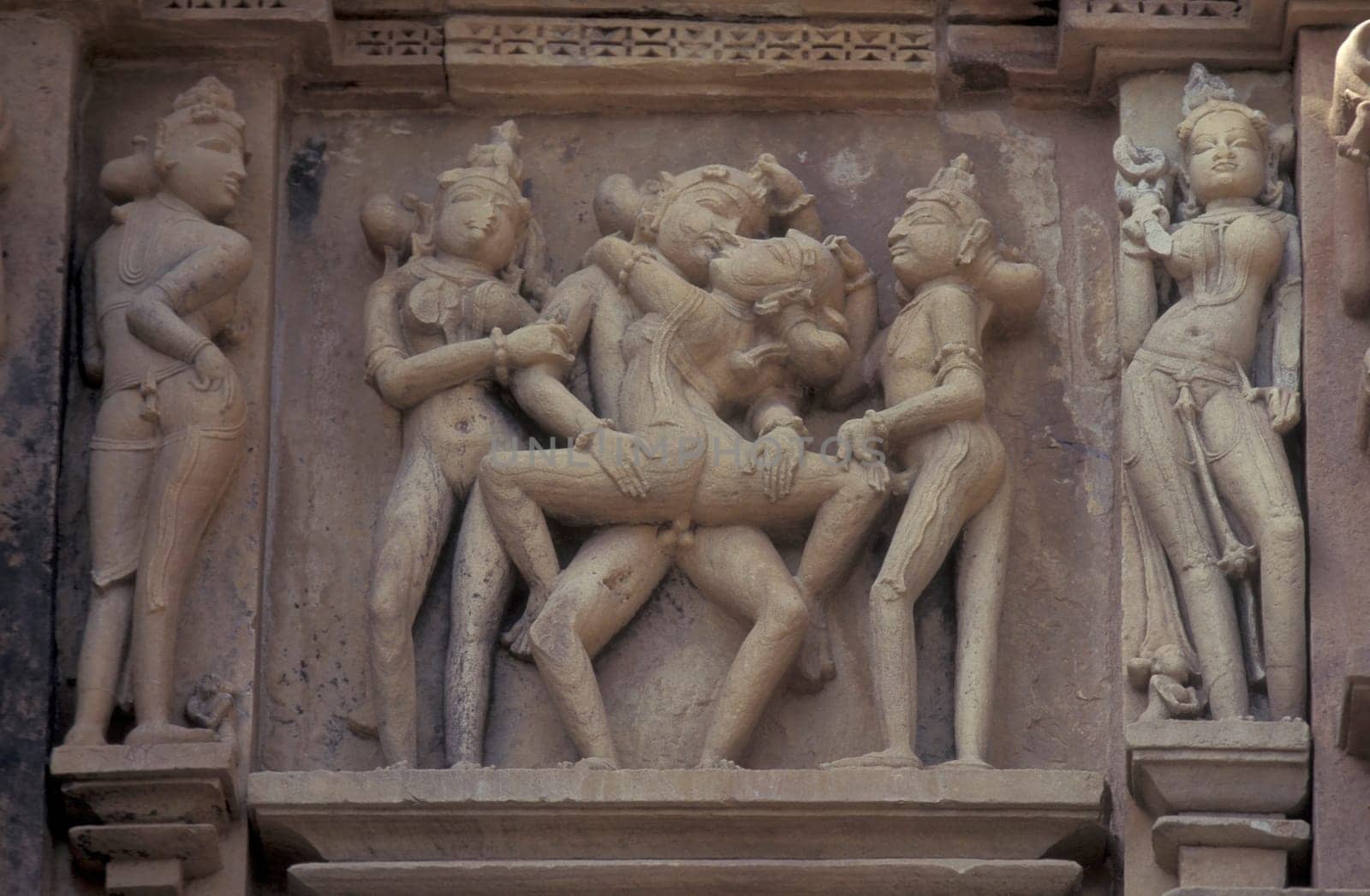 Erotic Sculptures at the erotic Temple or Hindu Temple of Kandarija Mahadeva Temple in the city of Khajurao in Province Madhya Pradesh in India.  India, Khajurao, April, 1998