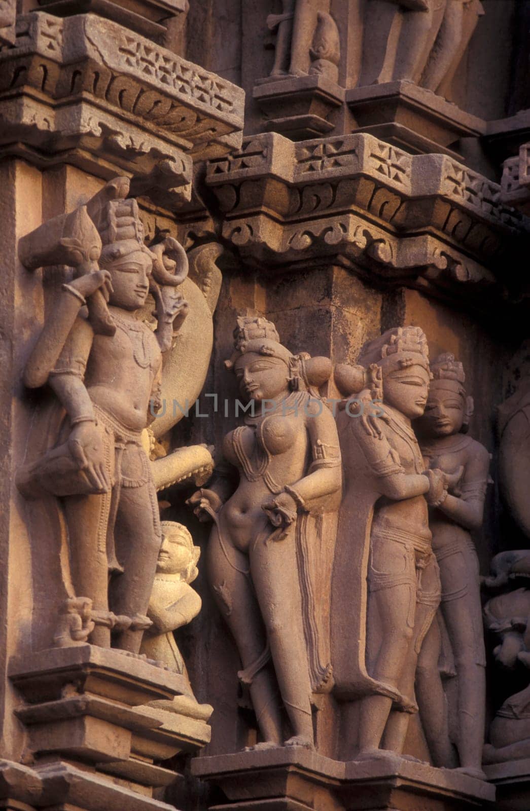 Erotic Sculptures at the erotic Temple or Hindu Temple of Kandarija Mahadeva Temple in the city of Khajurao in Province Madhya Pradesh in India.  India, Khajurao, April, 1998