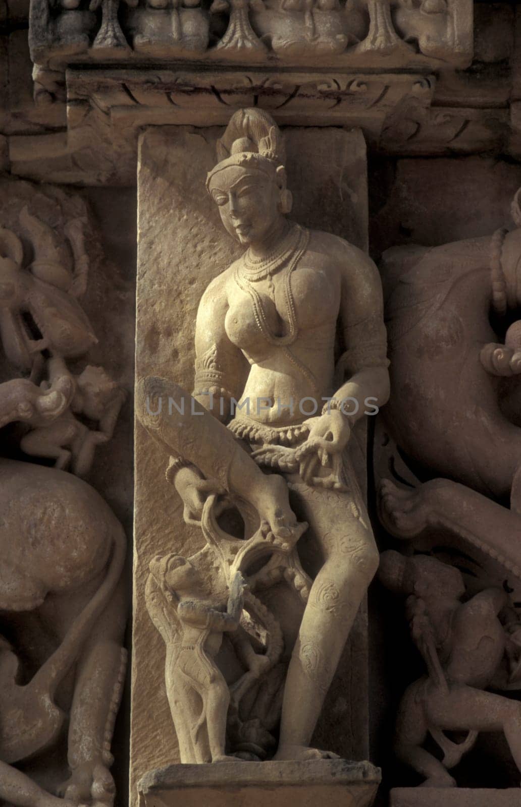 Erotic Sculptures at the erotic Temple or Hindu Temple of Kandarija Mahadeva Temple in the city of Khajurao in Province Madhya Pradesh in India.  India, Khajurao, April, 1998