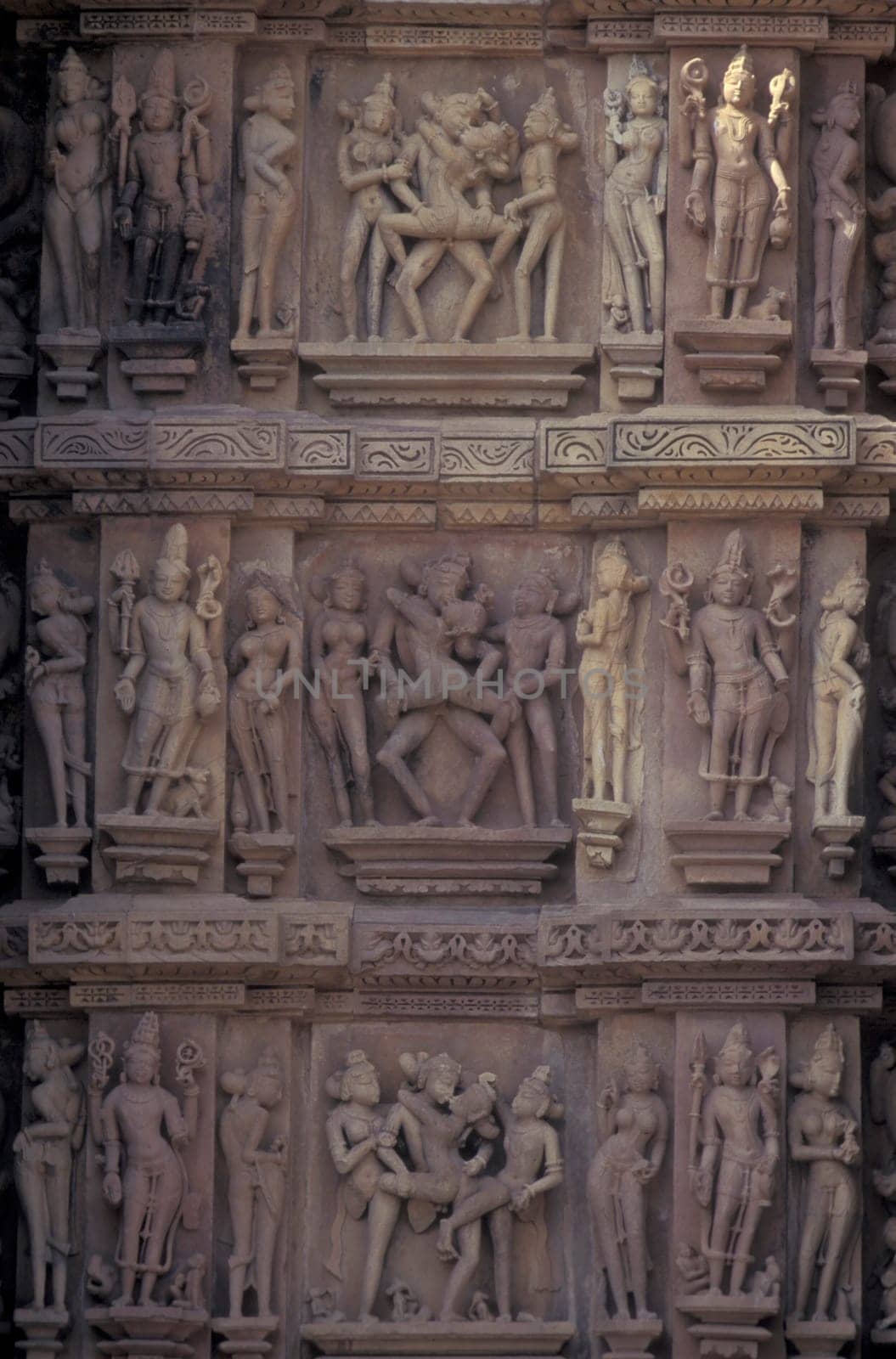 Erotic Sculptures at the erotic Temple or Hindu Temple of Kandarija Mahadeva Temple in the city of Khajurao in Province Madhya Pradesh in India.  India, Khajurao, April, 1998