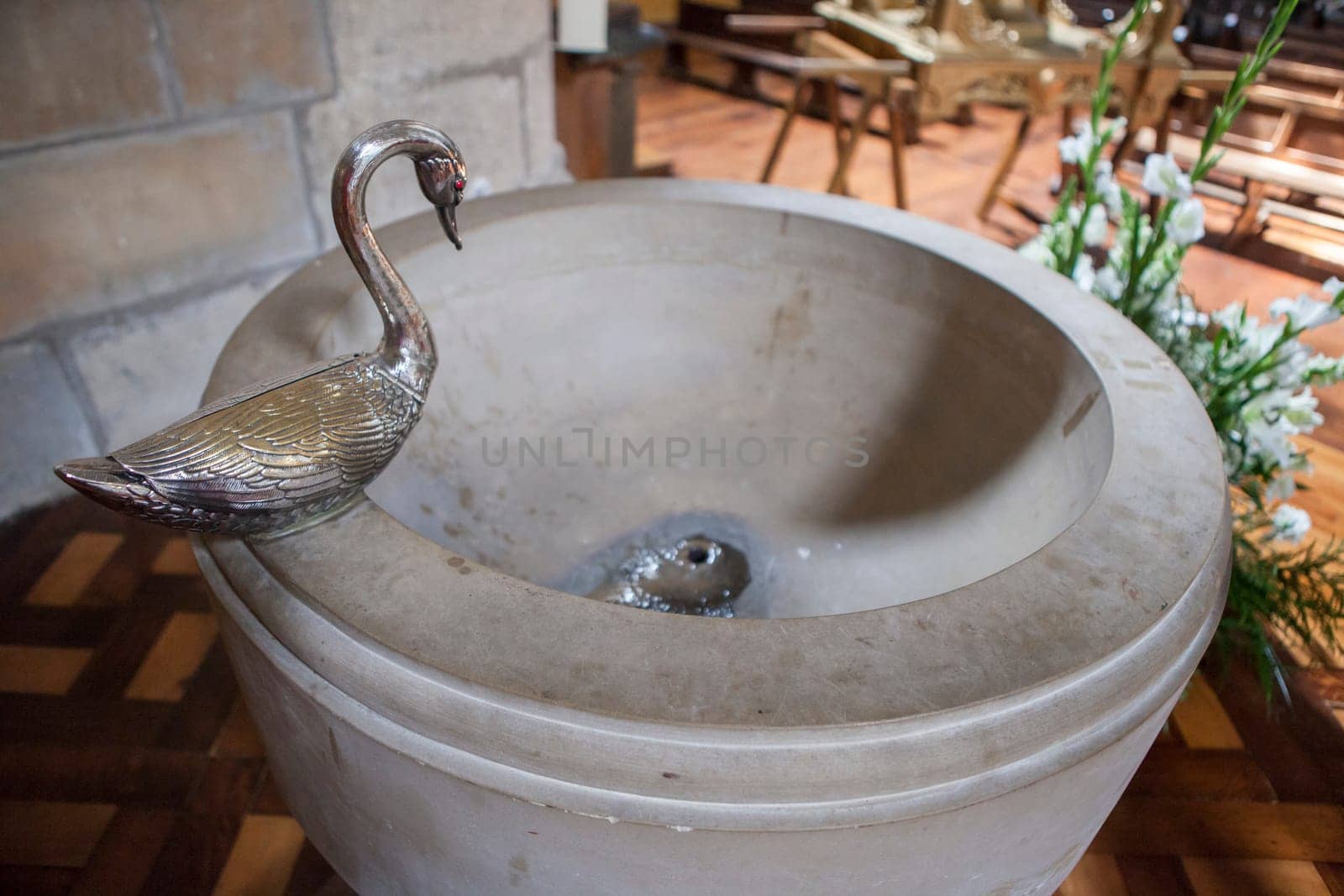 Gares, Spain - March 30, 2024: Church of Santiago, Puente La Reina, Navarre, Spain. Baptismal font
