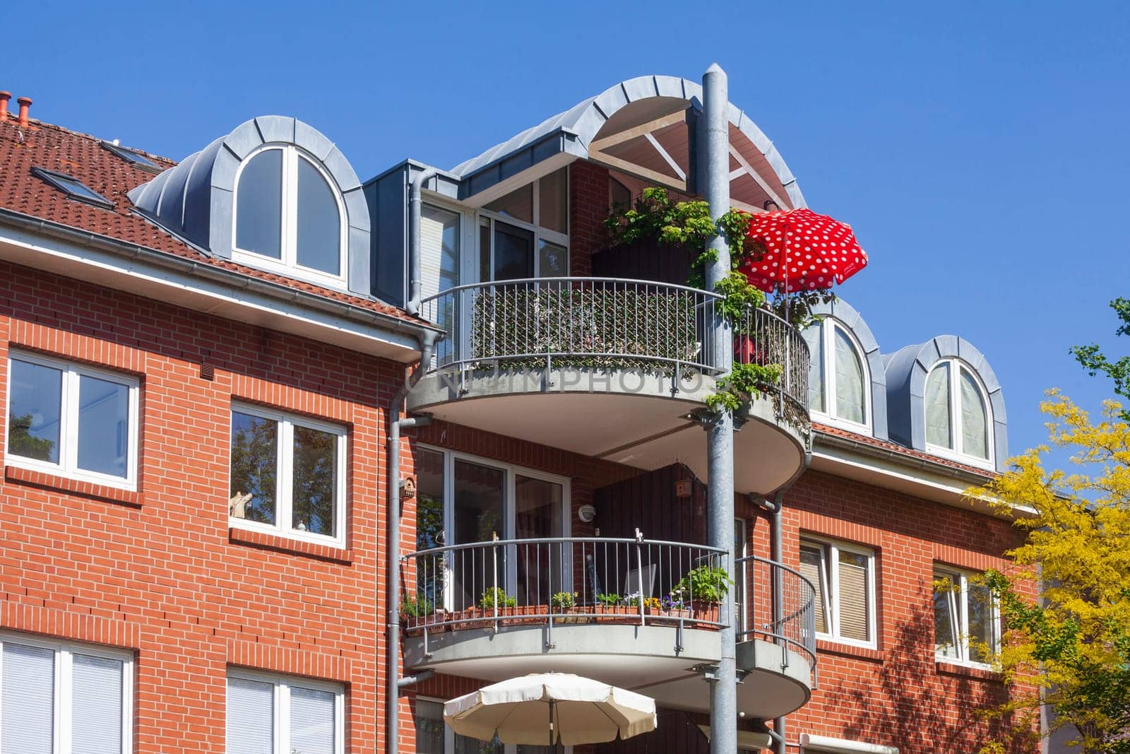 Modern brick residential building with balcony and sunshade, Buxtehude, Lower Saxony, Germany