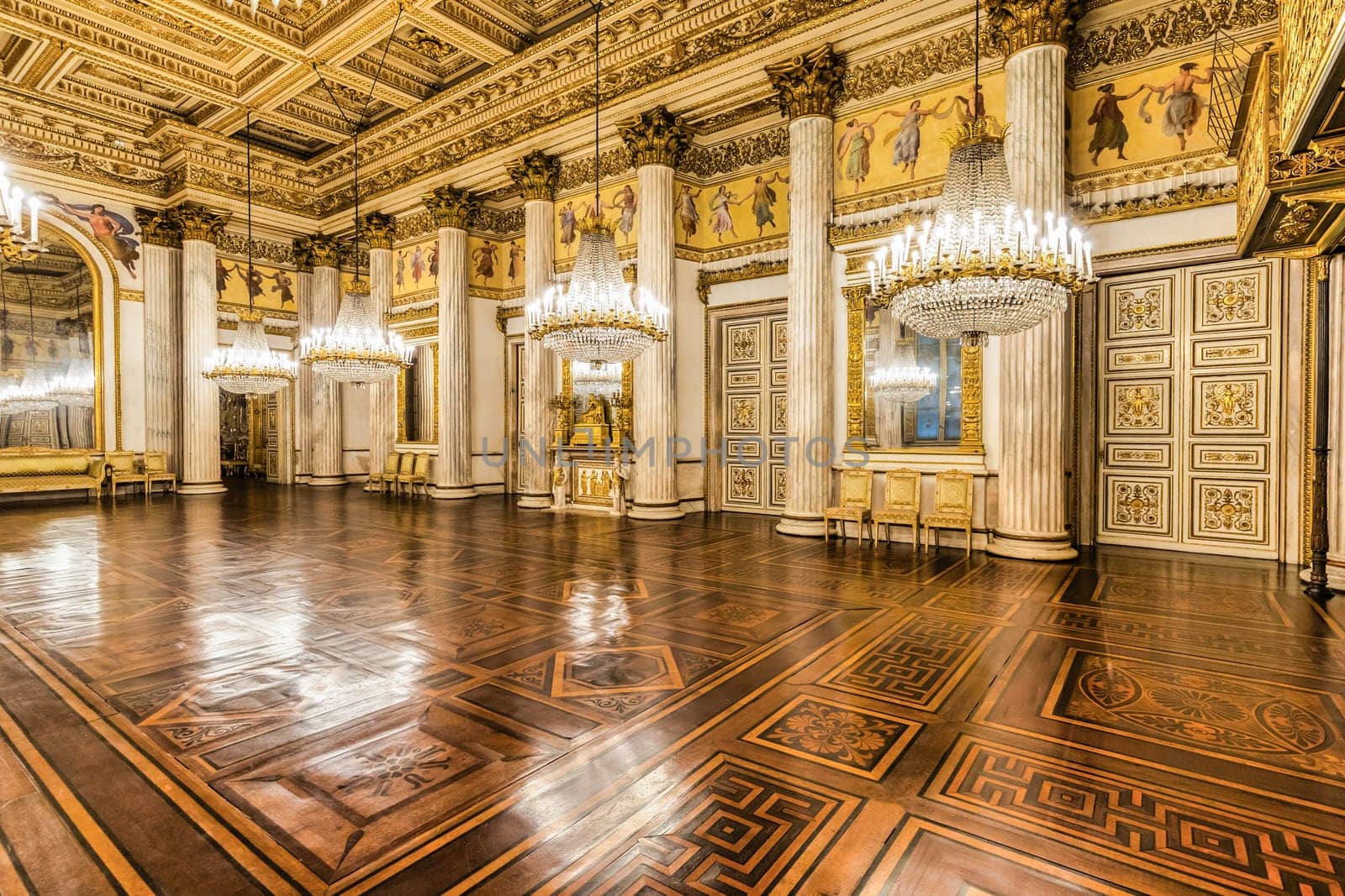 Turin, Italy - 17 november 2023: baroque ballroom interior in Royal Palace, 1842. Luxury marble, antique chandelier, classic floor