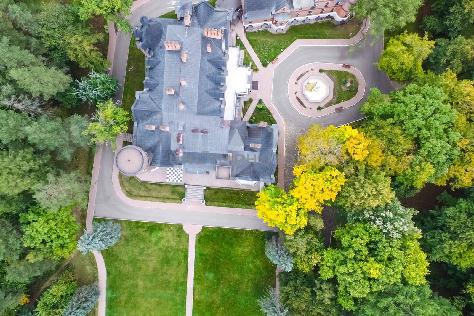 Castle in Moscow in the park. A modern Moscow castle surrounded by trees